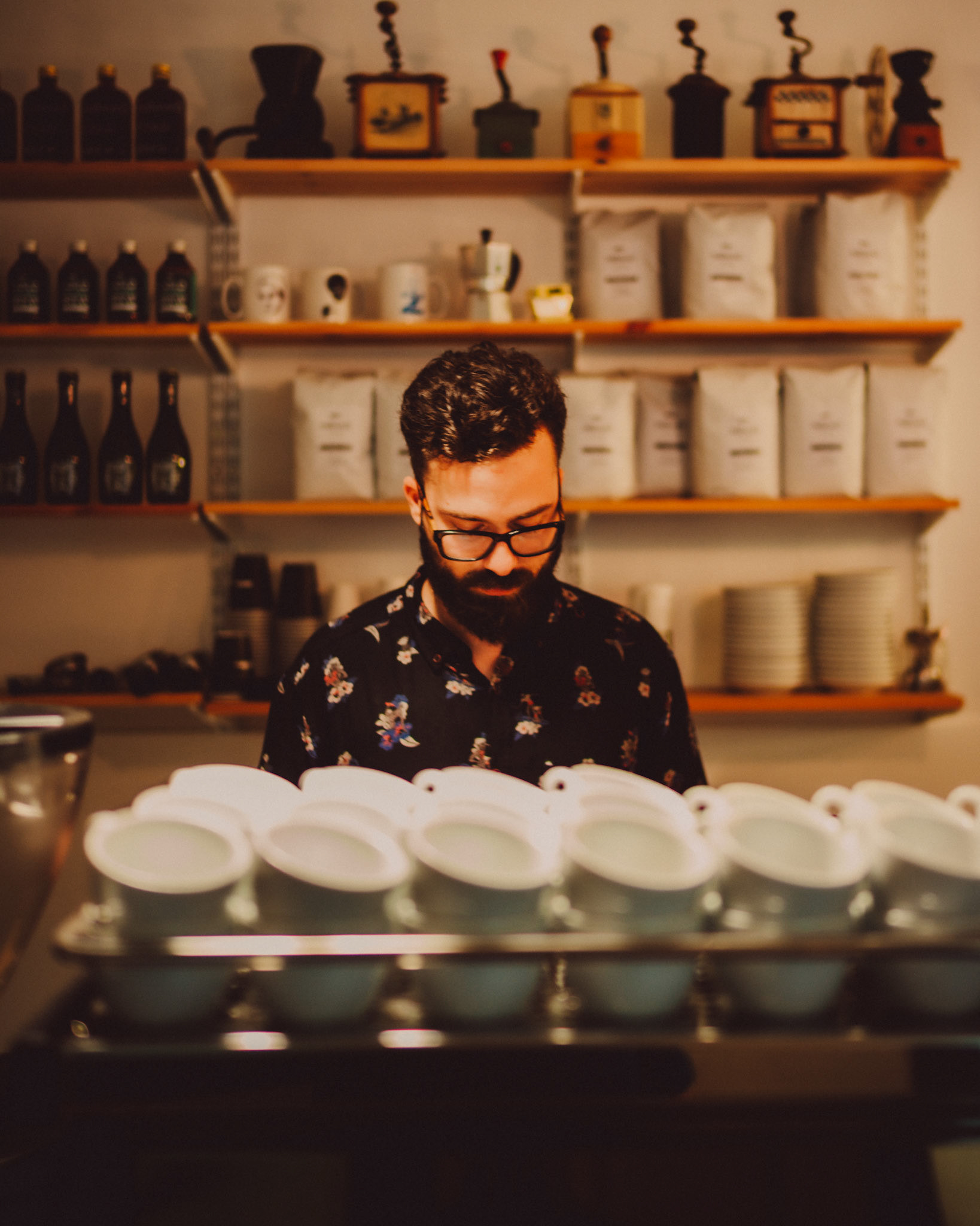 A barista wearing dark rimmed glasses, Nomad Coffee, Barcelona, Spain, July 2016, Leica M.