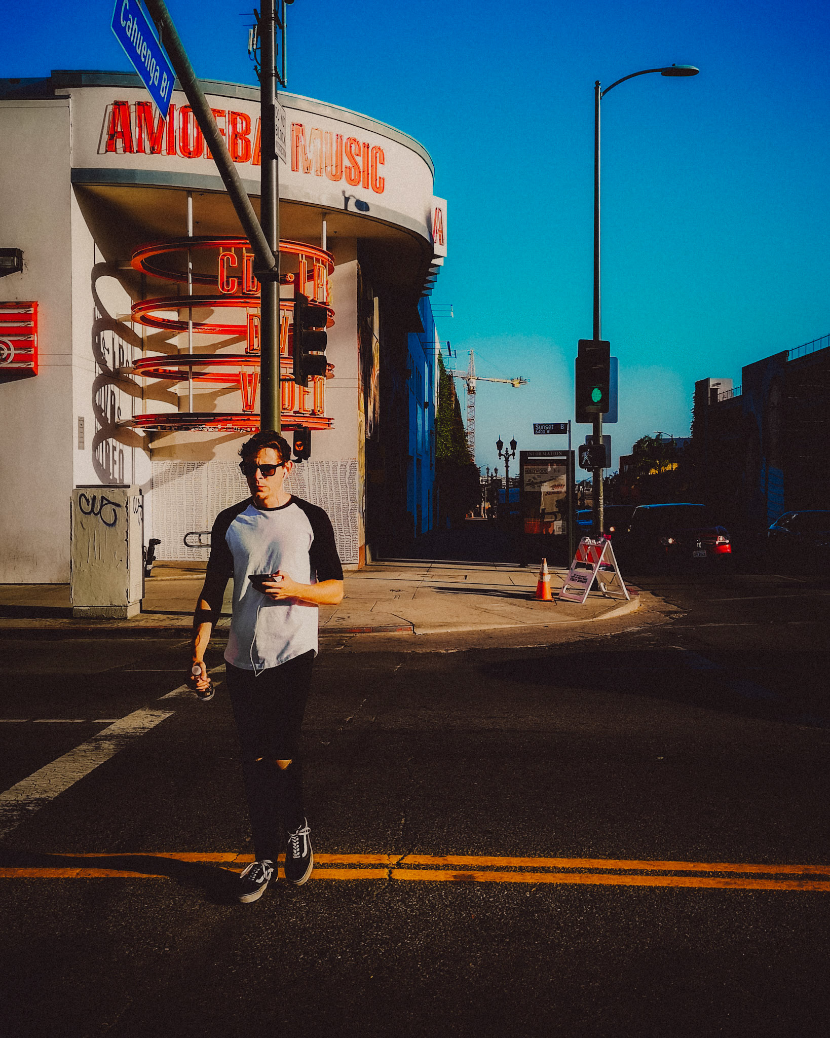A male pedestrian in front of Amoeba Music, Los Angeles, California, USA, July 2018, Huawei P20 Pro.