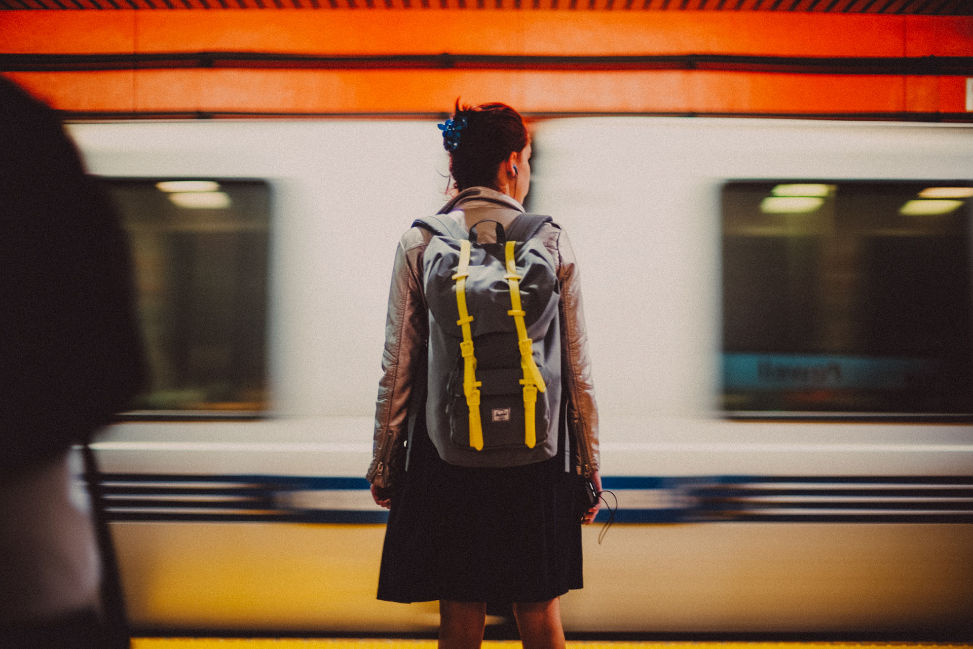 A girl wearing a Herschel Backpack, Powell BART Station, San Francisco, California, USA, May 2014, Leica M Day One.
