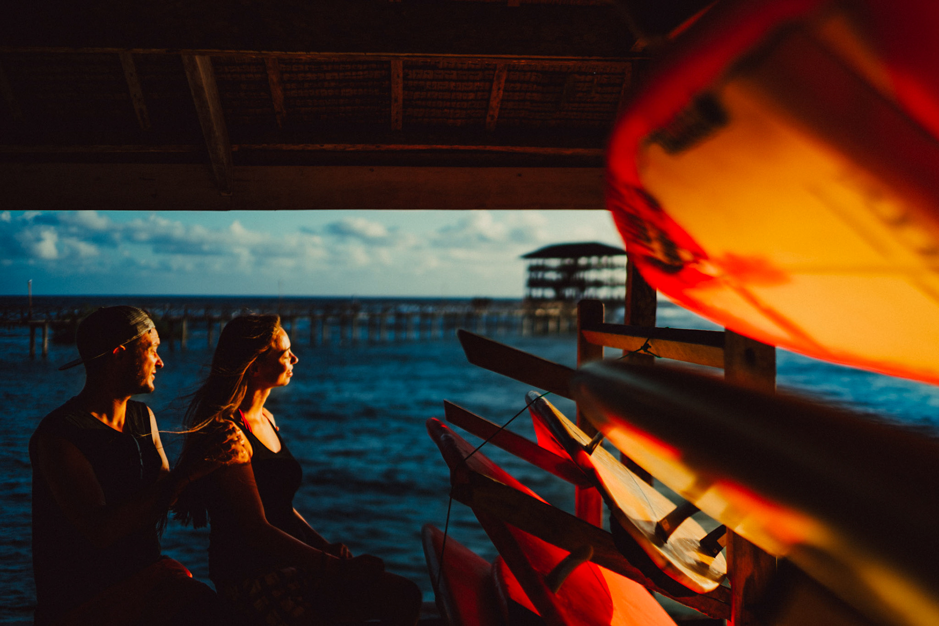 Candid and chill morning couple portraits, in boardshorts, tanktops, surfboards and all, Cloud 9, Siargao Island, Philippines, Southeast Asia, March 2019, Sony A7III.