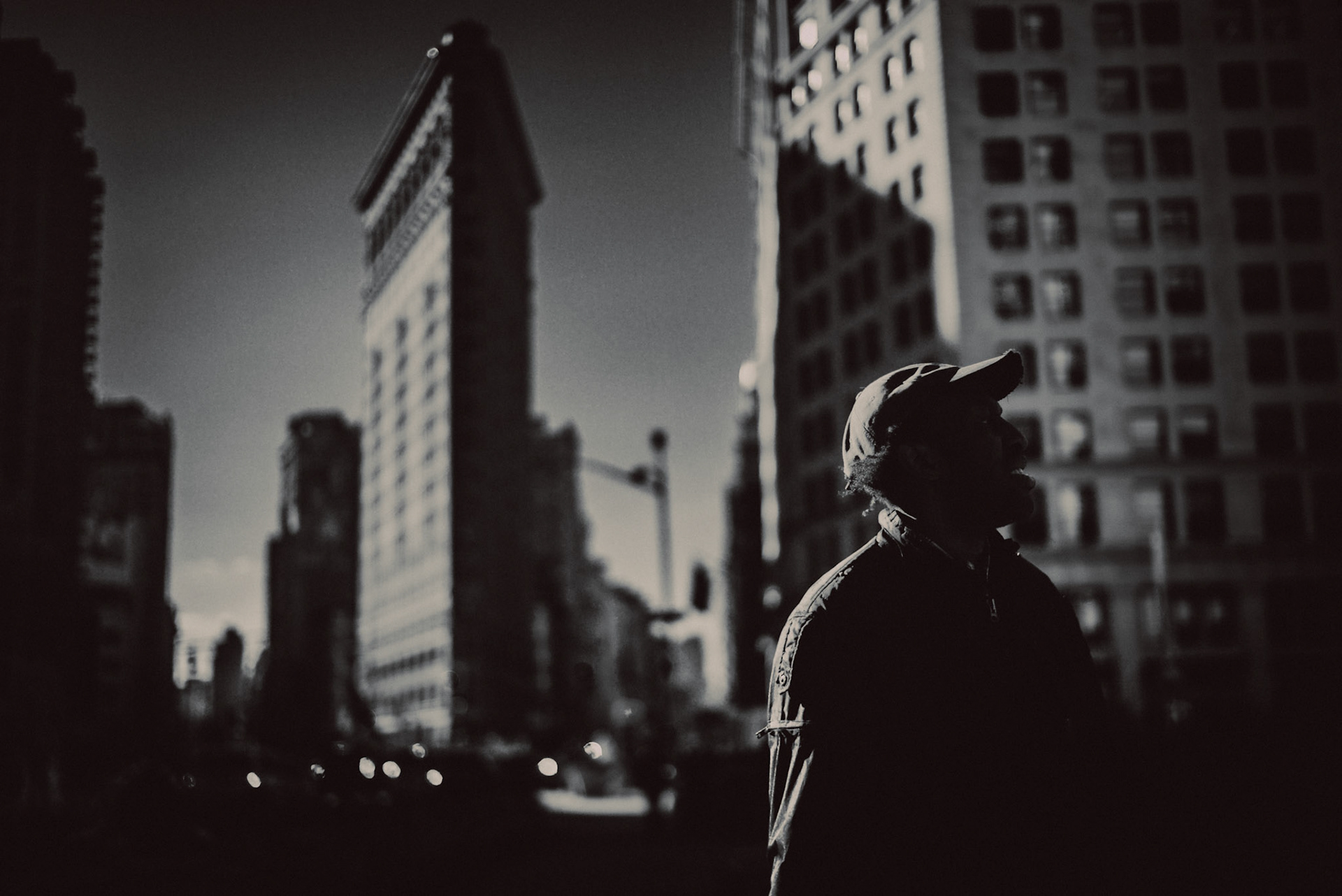 An african-american man in front of the Flatiron Building, Manhattan, New York City, USA, December 2017, Leica M.