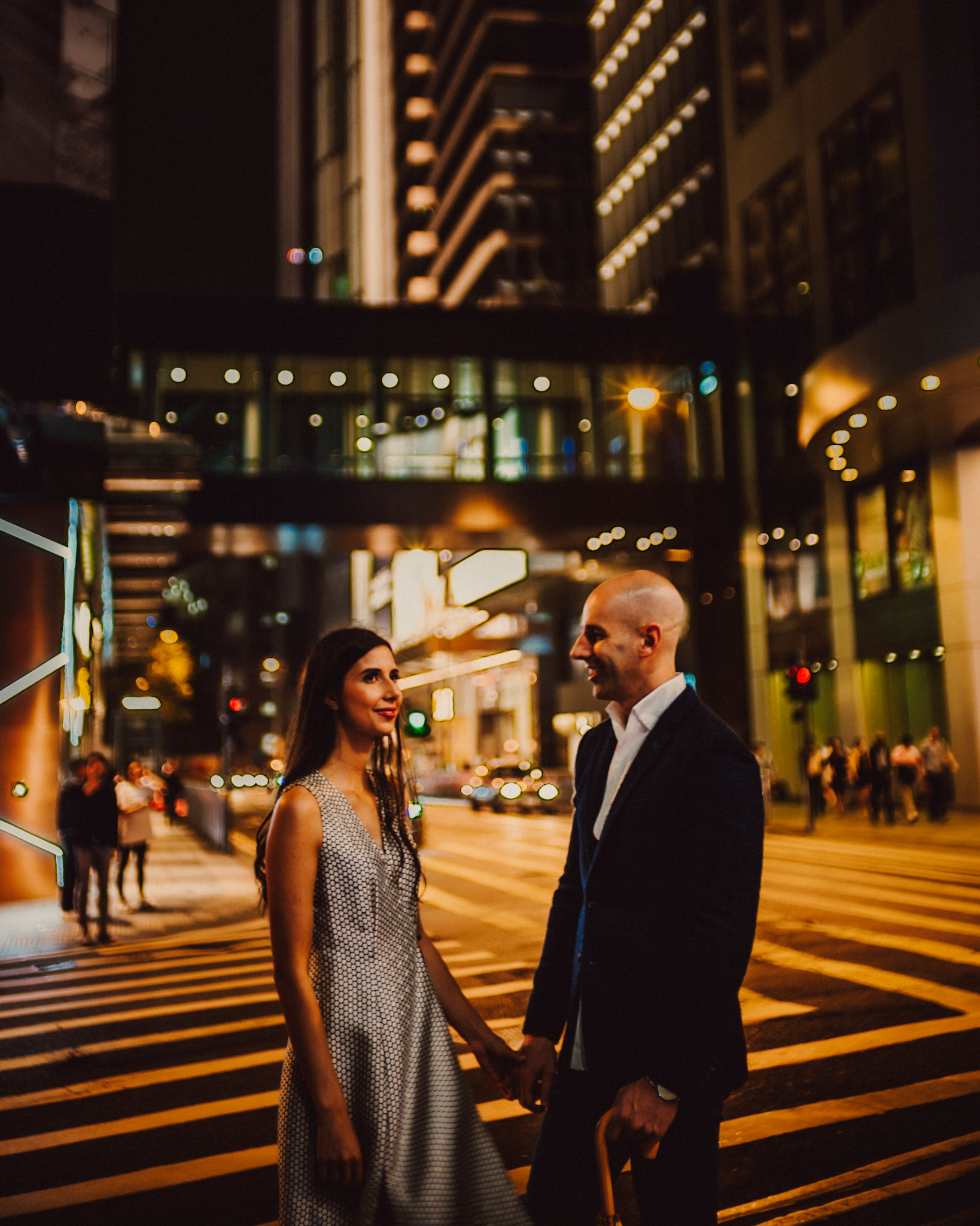 A moody, late night pre wedding photo shoot in Central Hong Kong with Eric and Sabrina. A reportage and street style set with a bystander in one of the Stanley Street's alleyways.
