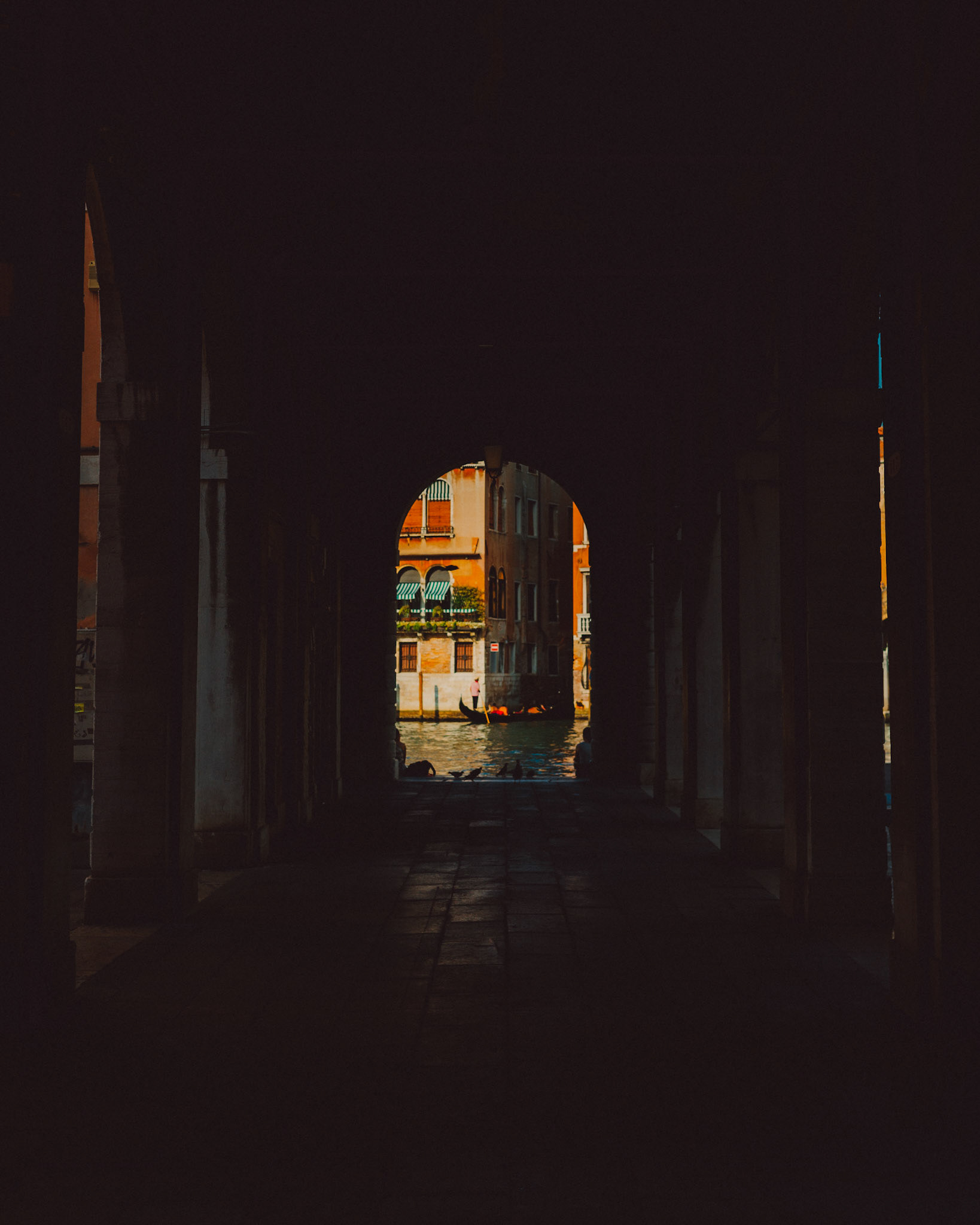 An archway framing a gondolier, Venice, Italy, August 2017, Leica M.