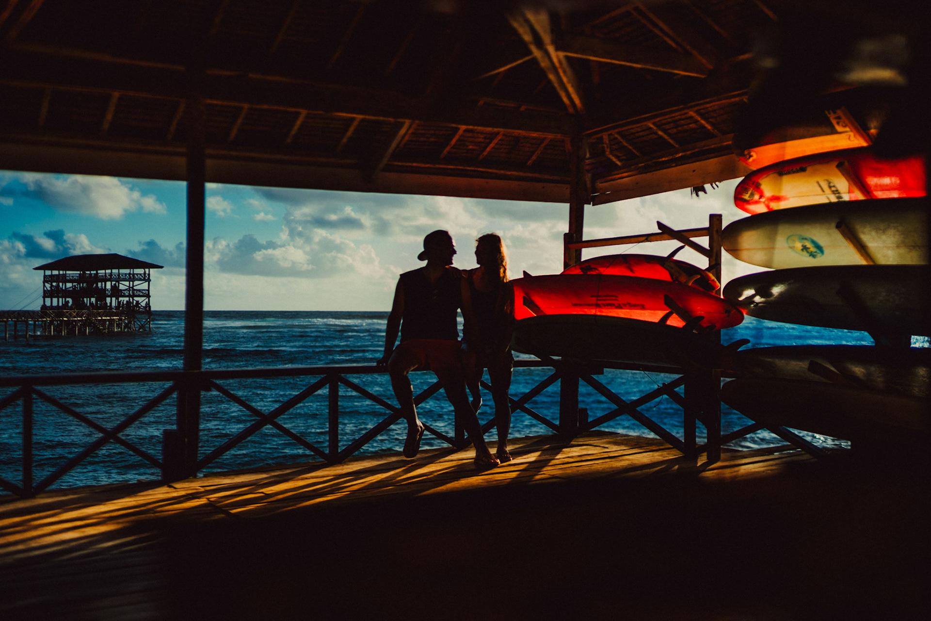 Early morning couple silhouettes, surfboards and all, Cloud 9, Siargao Island, Philippines, Southeast Asia, March 2019, Sony A7III.