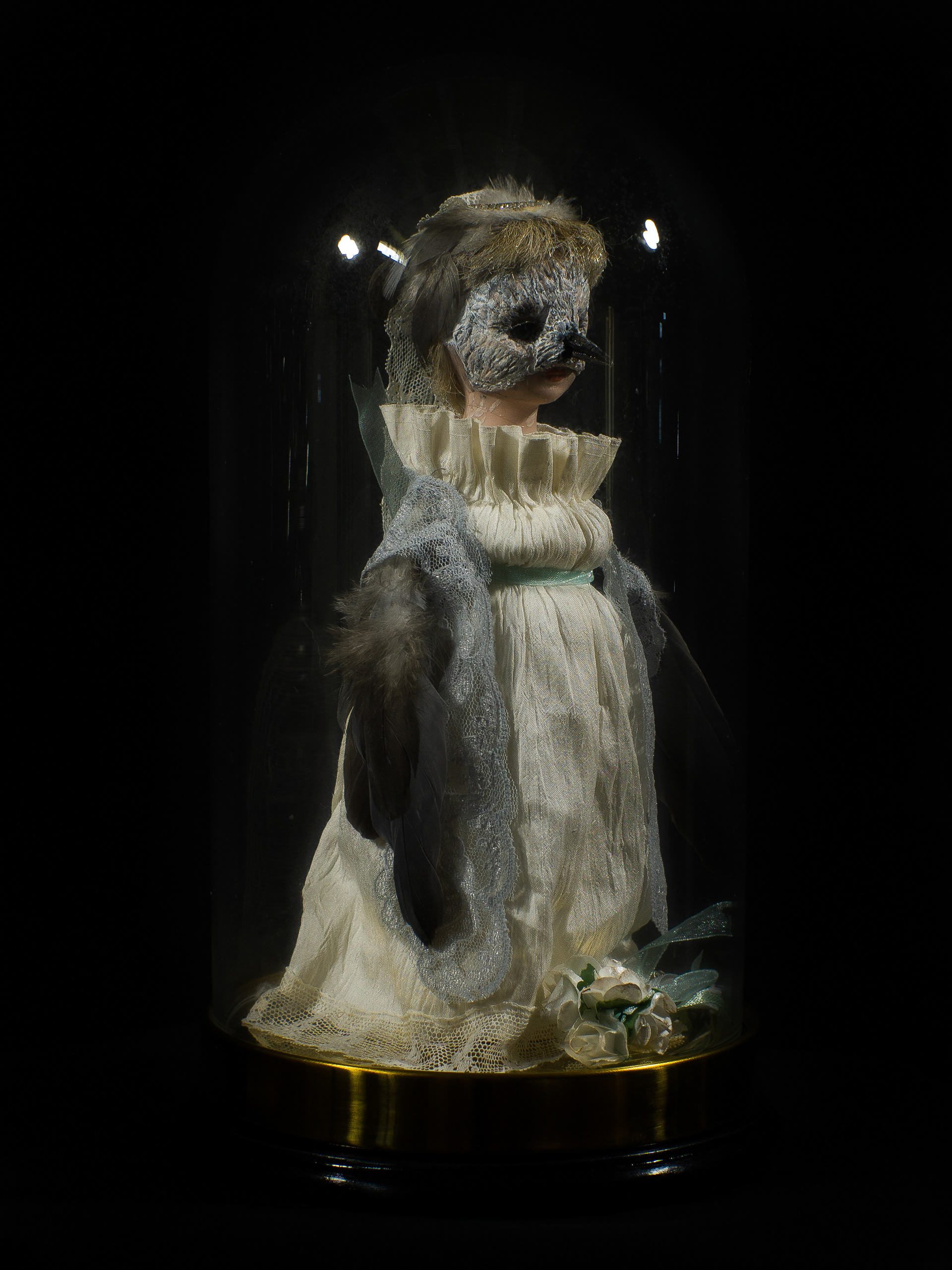 Mistaken Identity - Vintage doll, clay, feathers, silk, glass and brass bell jar on a wooden base. 28 x 15