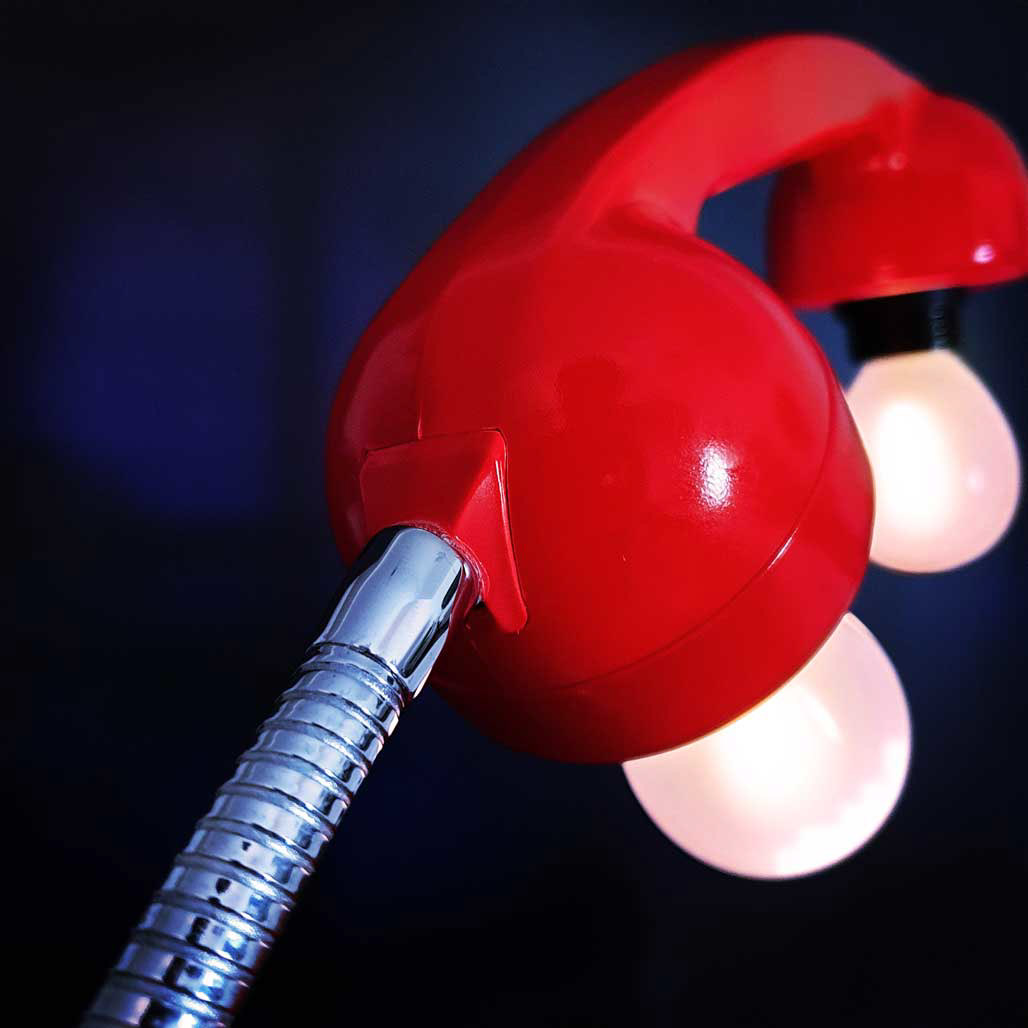 Flexible arm to adjust position of handset