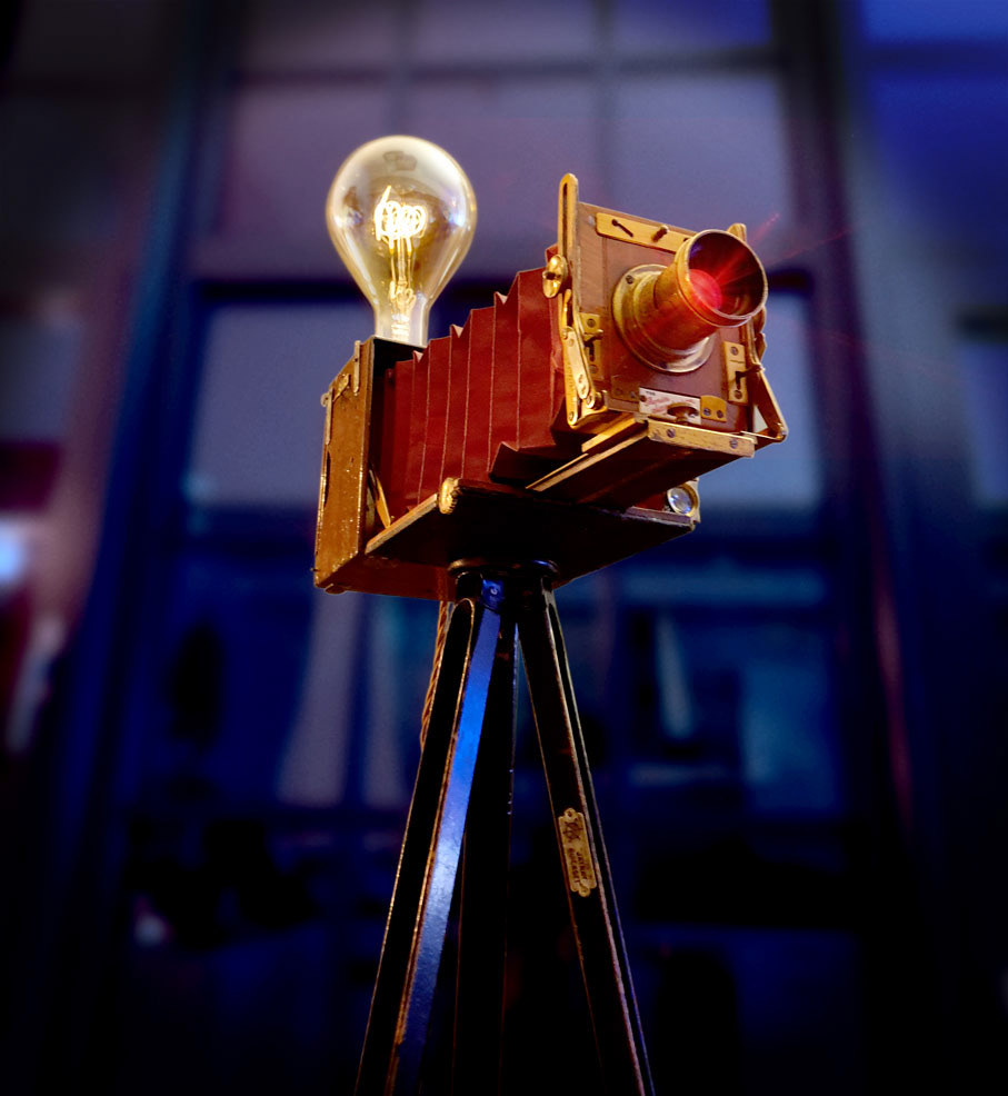 Antique camera with vintage bulb and red glow lens
