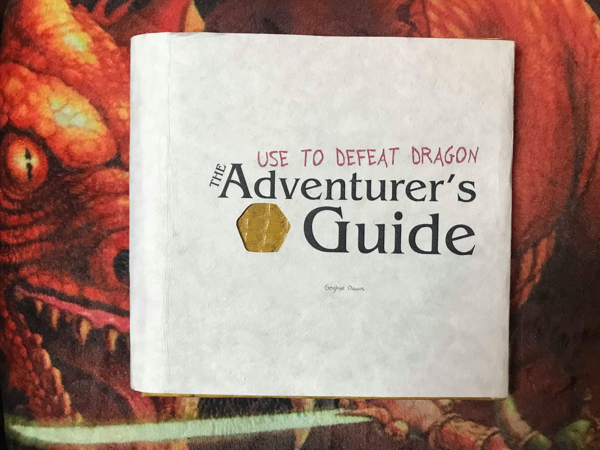 Main cover with diecut in shape of D20