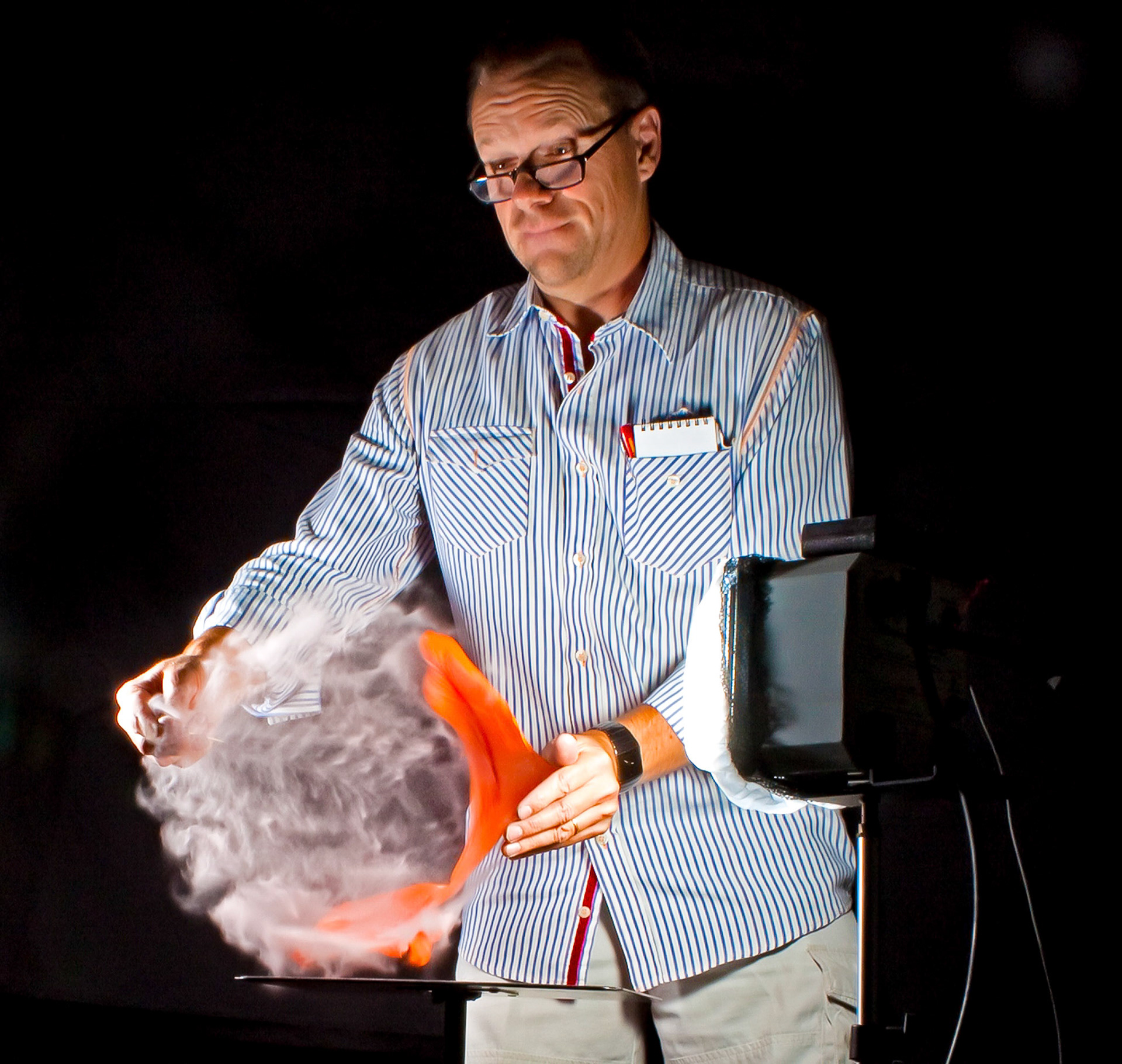 Balloon frozen mid-pop using open flash technique. 30 people in the workshop captured the same moment on their cameras.