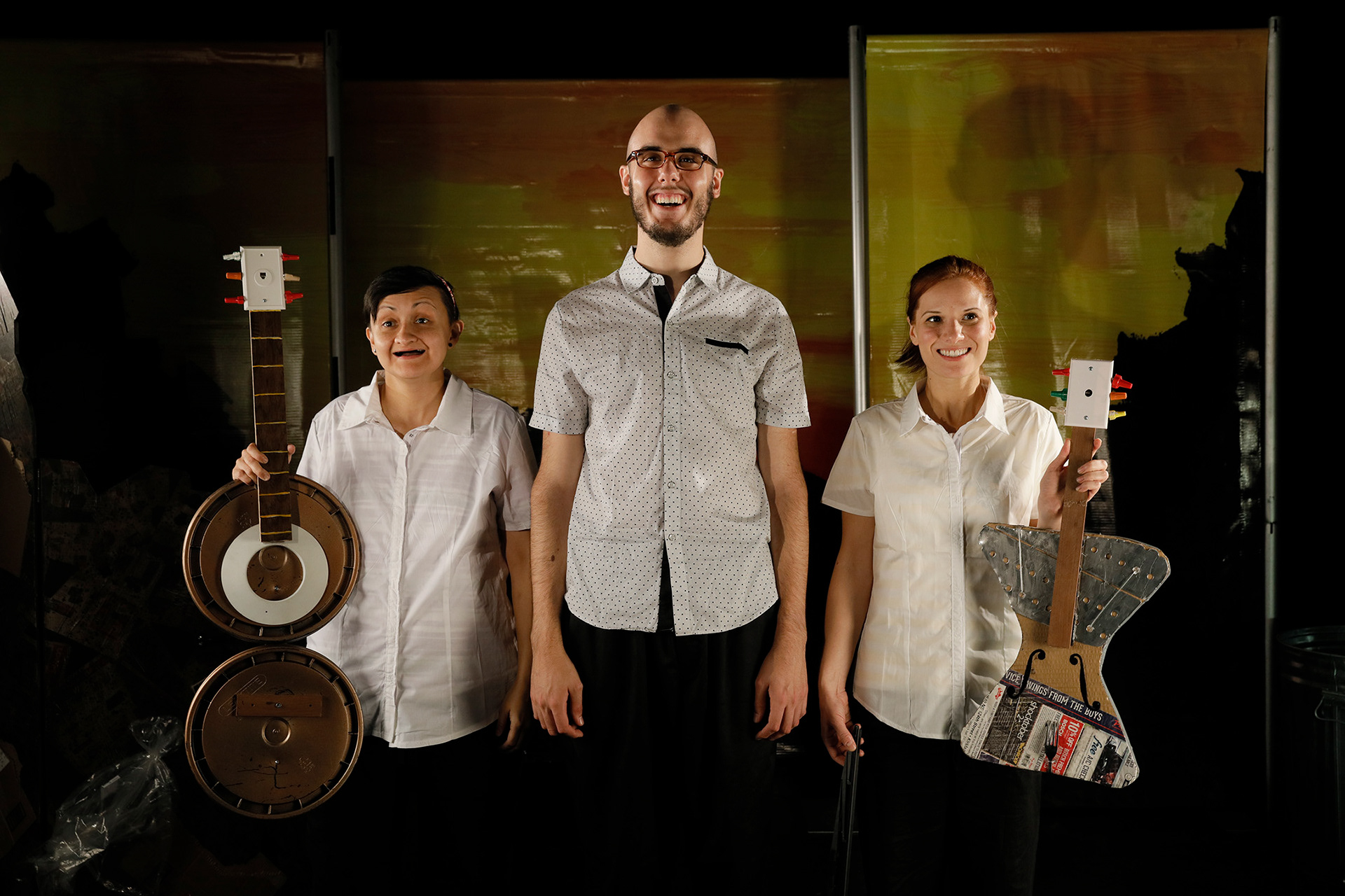 ADA'S VIOLIN : Recycled instruments assembled from garbage piles on stage (photo by Chris Bennion)