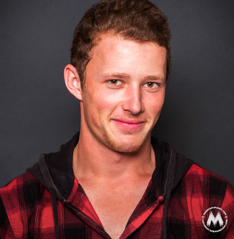 A studio portrait of international push bike aerial performer and cross country racer Ryan Biggs, shot by Markham Lane.