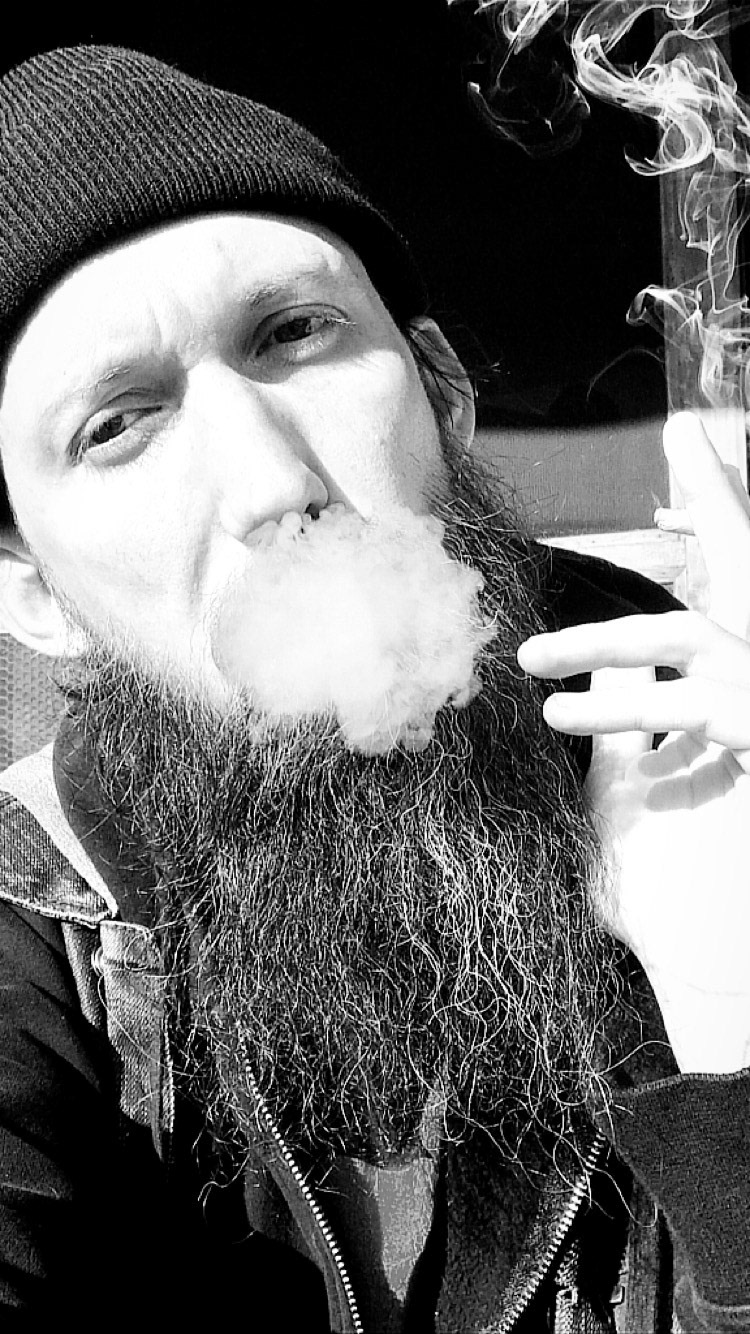 Blowing smoke.