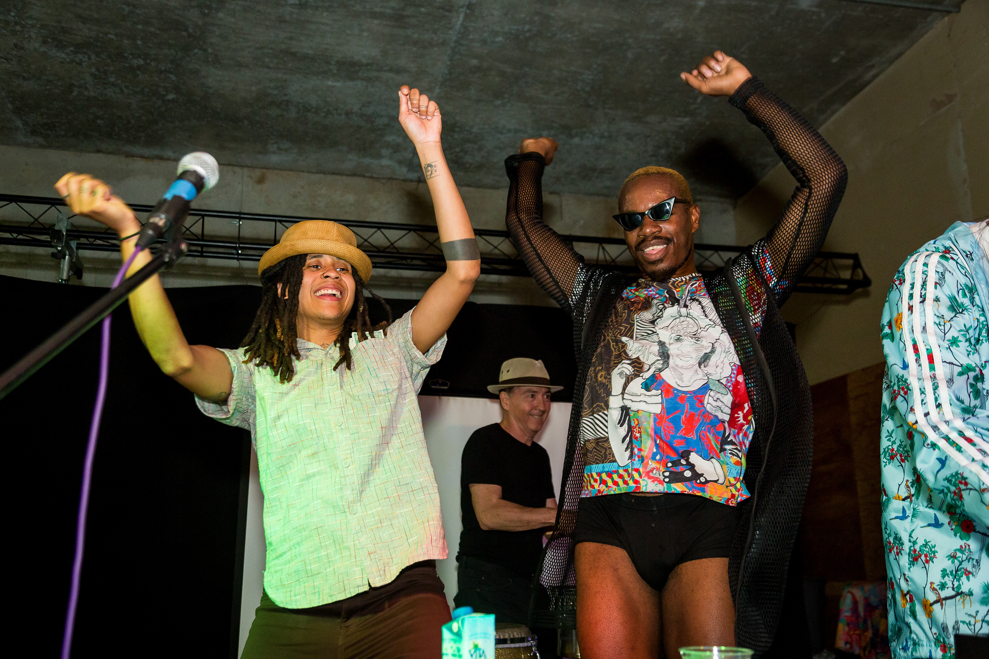 MC Ciara McKissick and Orb dance on stage.