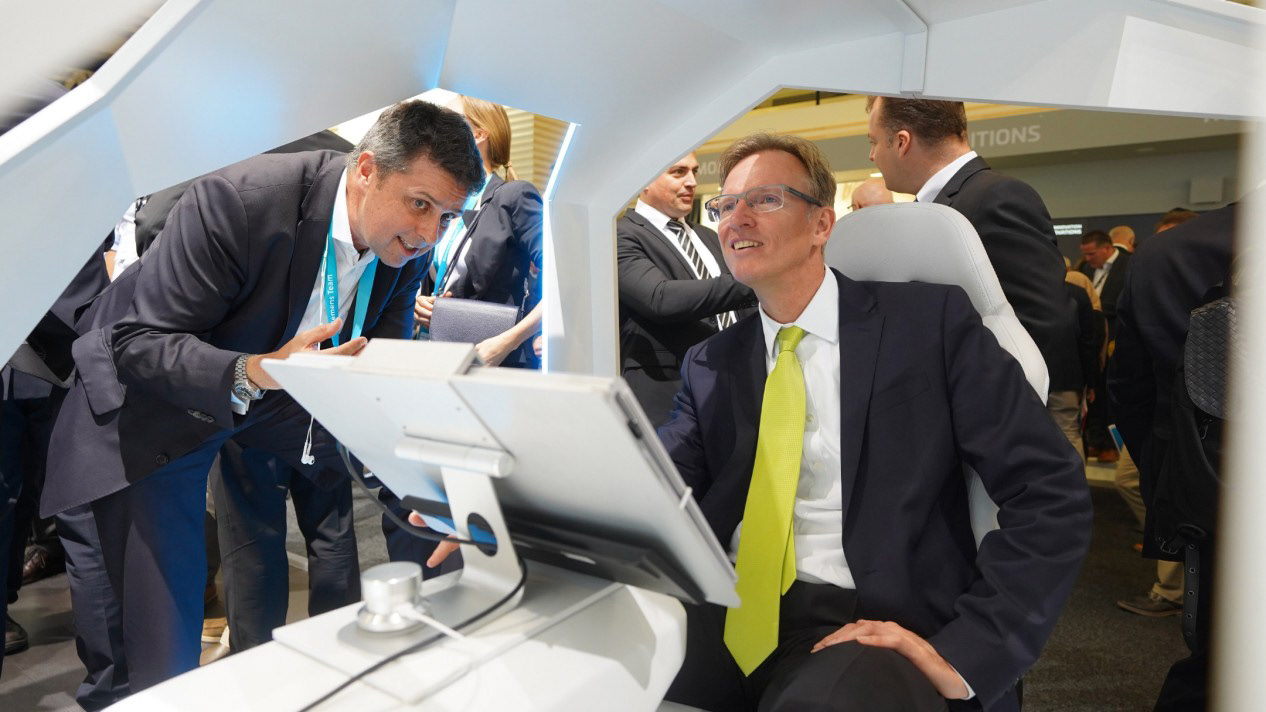 German Secretary of State for Transportation Dr. Gerhard Schulz sitting in the simulation booth