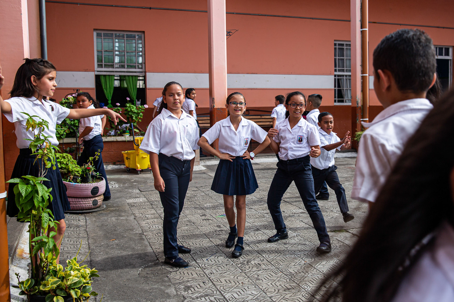Angie Moreno playing with her friends during recess.