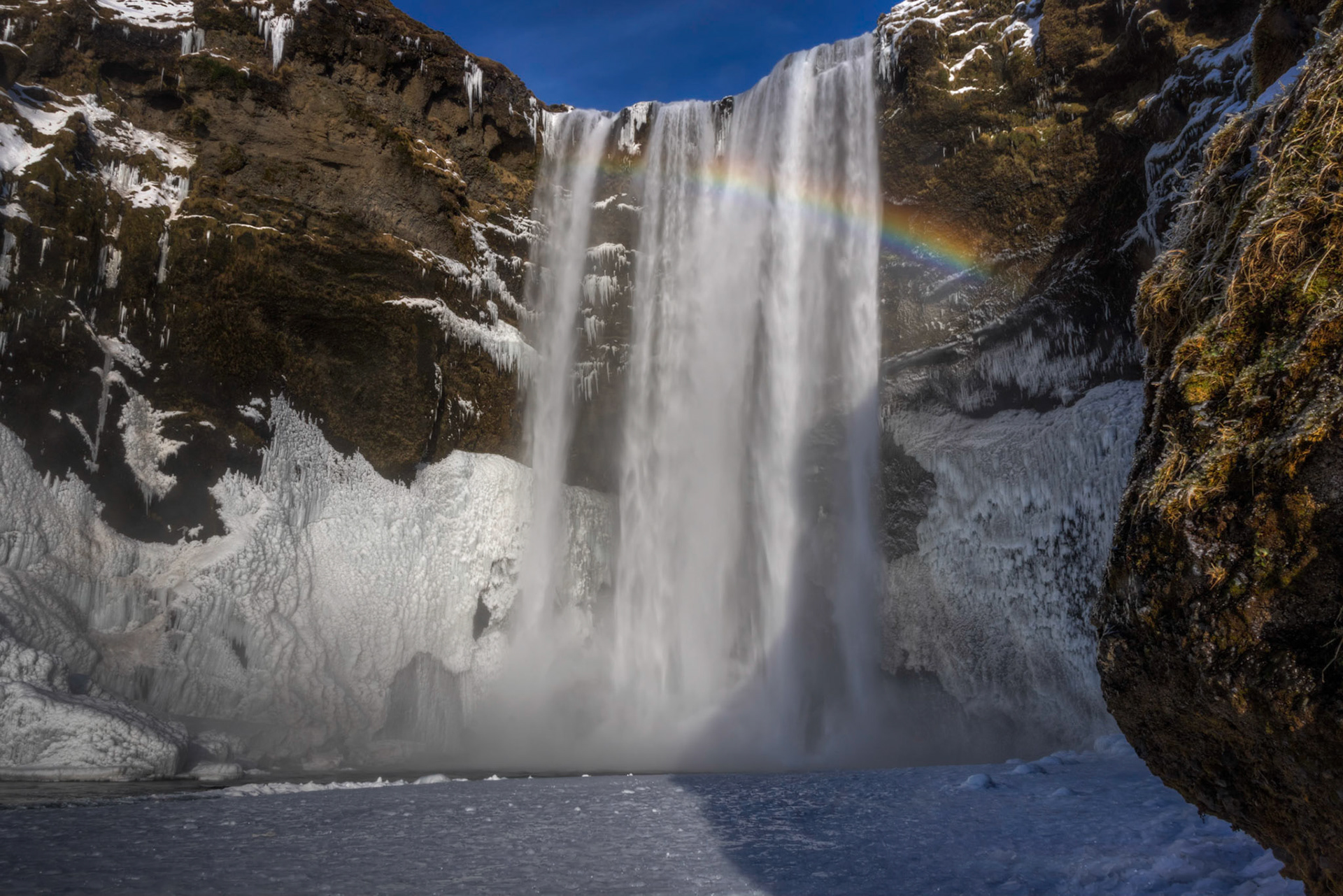 Falls of the Skógá River, as it descends from between Eyjafjallajökull and Mýrdalsjökull.Suðerland, IcelandFebruary 8, 2016This is an HDR image consisting of 5 exposures merged in Photomatix Pro. Additional processing in Lightroom and Photoshop.PENTAX K-3, Sigma 18-250mm f/3.5-6.3 DC OS HSMISO 100 18 mm  ¹⁄₁₃ sec at ƒ / 18