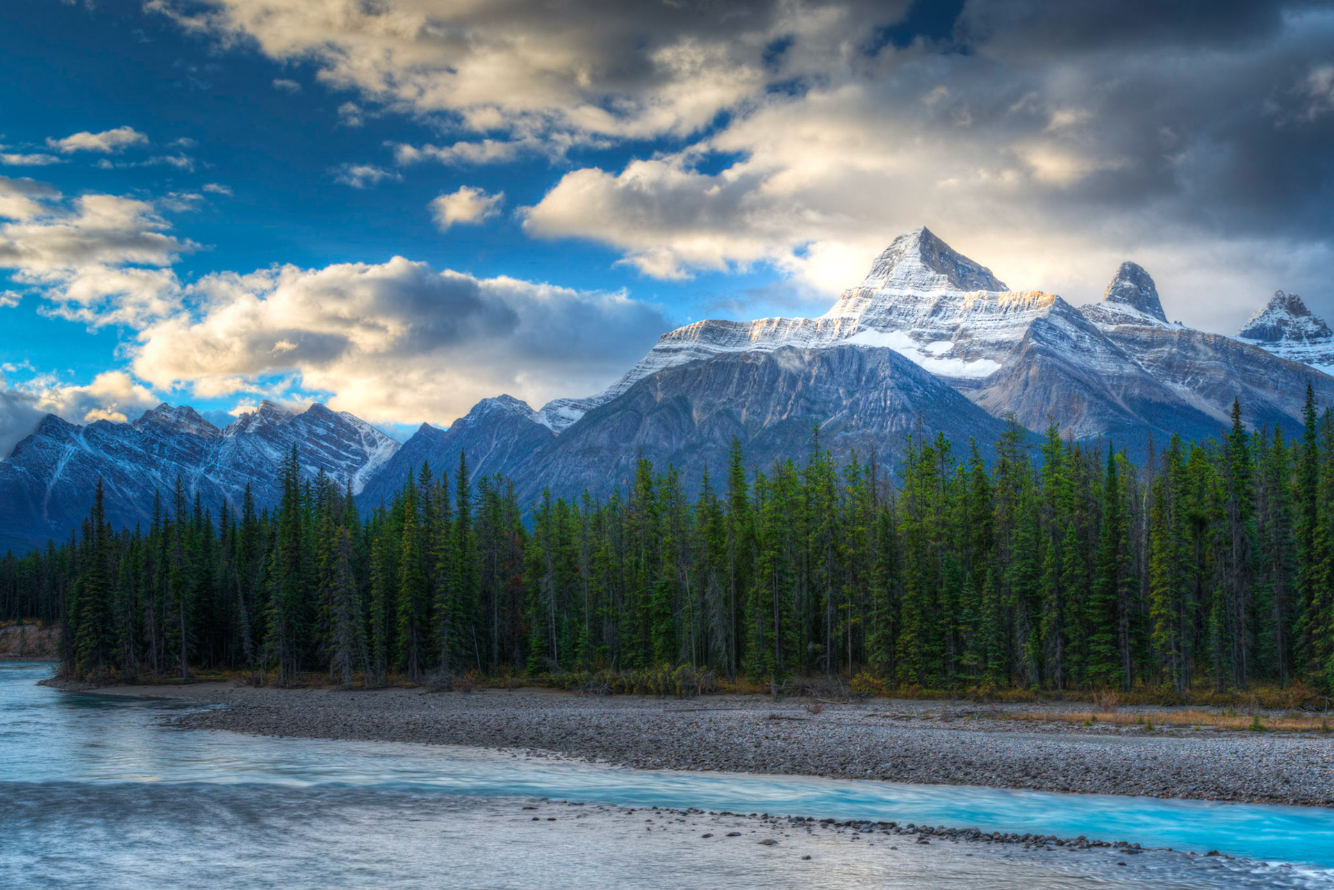 Early morning sunlight illuminating the shoulders of Mount Christie over the Athabasca River. Jasper National ParkAlberta, CanadaSeptember 24, 2016This is an HDR image consisting of 5 exposures merged in Photomatix Pro. Additional processing in Lightroom and Photoshop.PENTAX K-1, TAMRON 28-300mm F3.5-6.3 Ultra zoom XRISO 100 45 mm  0.4 sec at ƒ / 16