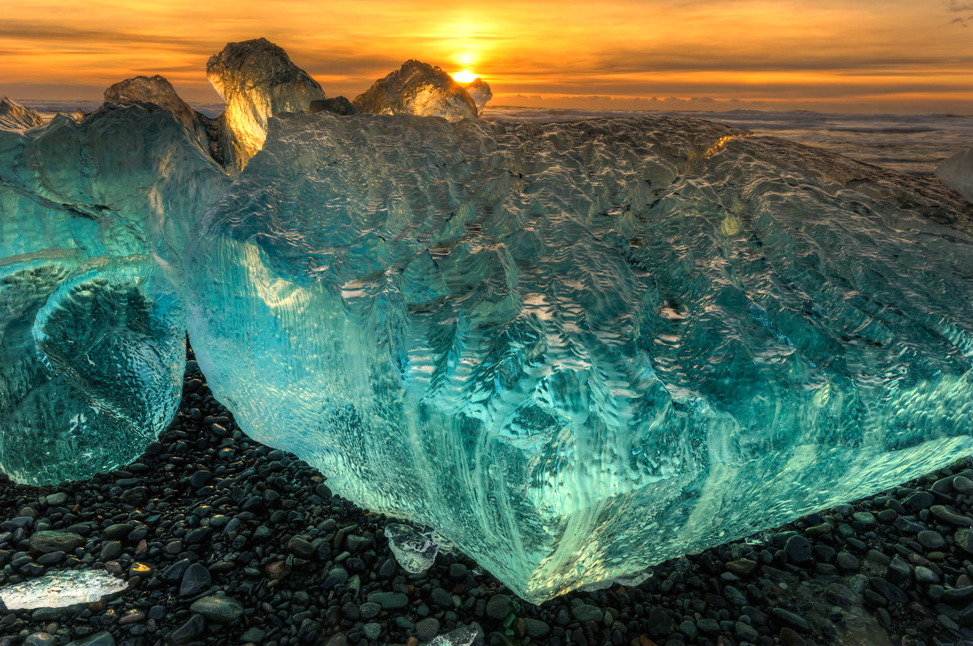 Sunrise at the ice beach at the outlet of Jökulsárlón.Austurland, IcelandFebruary 2, 2016This is an HDR image consisting of 5 exposures merged in Photomatix Pro. Additional processing in Lightroom and Photoshop.PENTAX K-3, Sigma 10-20mm f/4-5.6 EX DCISO 100 16 mm  ¹⁄₁₃ sec at ƒ / 18
