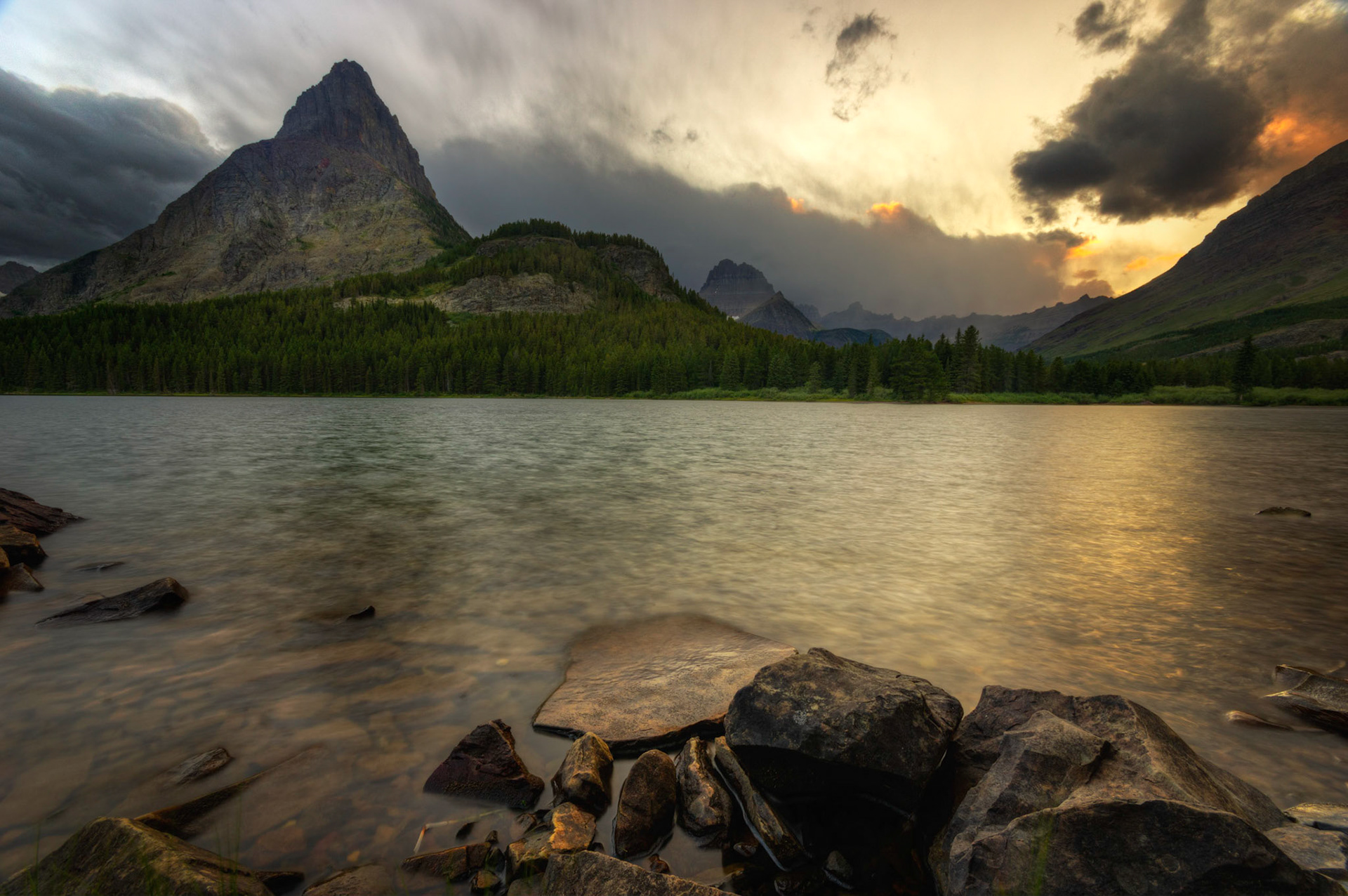 Sunset at Swiftcurrent Lake.Glacier National ParkJuly 28, 2015This is an HDR image consisting of 5 exposures merged in Photomatix Pro. Additional processing in Lightroom and Photoshop.PENTAX K-3, Sigma 10-20mm f/4-5.6 EX DCISO 100 10 mm  0.5 sec at ƒ / 11