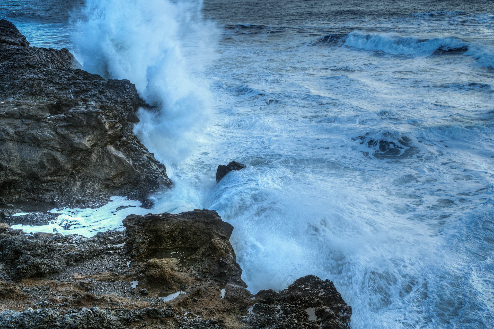 Waves of the North Atlantic crashing against the rocky shores at Reynisdrangar.ReynisdrangarSuðerland, IcelandFebruary 8, 2016This is an HDR image consisting of 5 exposures merged in Photomatix Pro. Additional processing in Lightroom and Photoshop.PENTAX K-3, Sigma 18-250mm f/3.5-6.3 DC OS HSMISO 100 24 mm  ¹⁄₁₀ sec at ƒ / 9.0