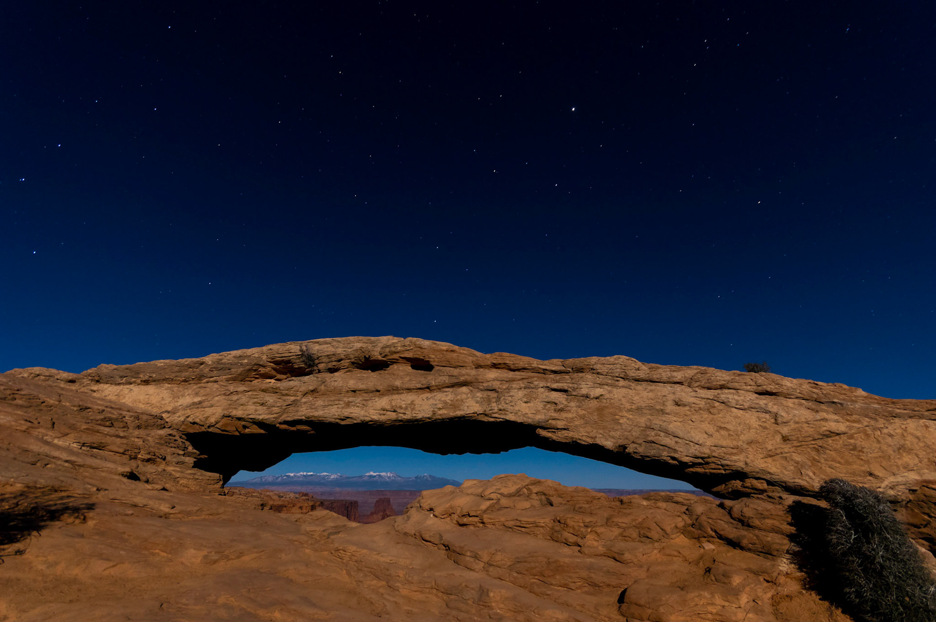 Mesa Arch under the light of a full moon.  The constellations of Ursa Major, Leo, and the planet Jupiter are visible in this image as well.Canyonlands National Park6 November 2014PENTAX K-3, Sigma 10-20mm f/4-5.6 EX DCISO 1000 10 mm  30.0 sec at ƒ / 6.3Prints of my work are available from my website at http://www.fingolfinphoto.comFollow me on Facebook at http://www.facebook.com/fingolfinphoto or http://www.facebook.com/pesterleAlso, http://500px.com/pesterle   http://www.flickr.com/photos/fingolfinphoto
