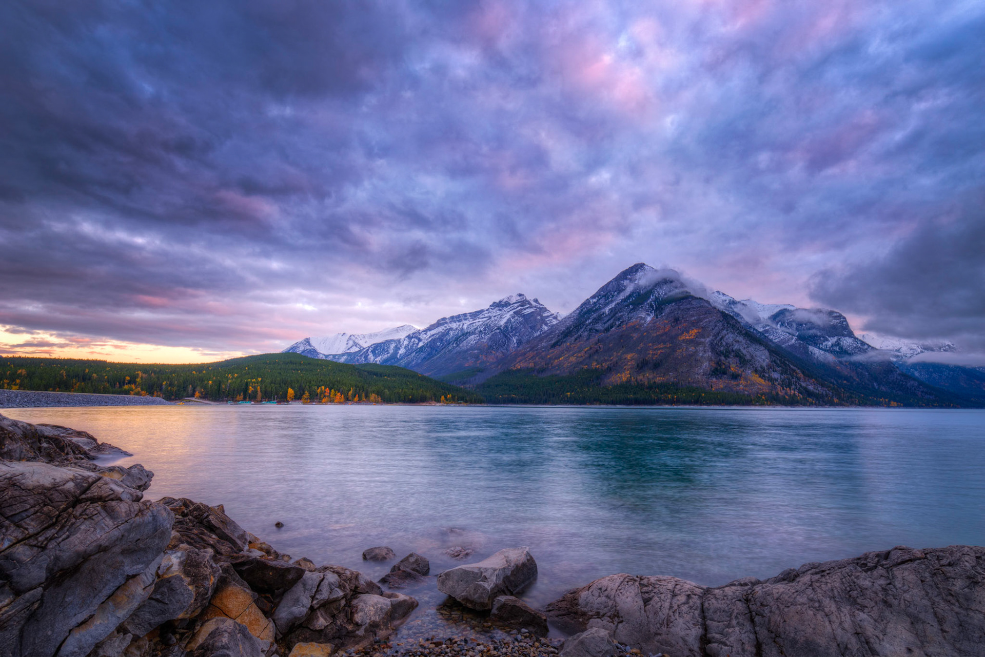 Sunrise on a cloudy morning at Lake Minnewanka.Banff National ParkAlberta, CanadaSeptember 21, 2016This is an HDR image consisting of 5 exposures merged in Photomatix Pro. Additional processing in Lightroom and Photoshop.PENTAX K-1, HD PENTAX-D FA 15-30mm F2.8ED SDM WRISO 100 18 mm  0.3 sec at ƒ / 18