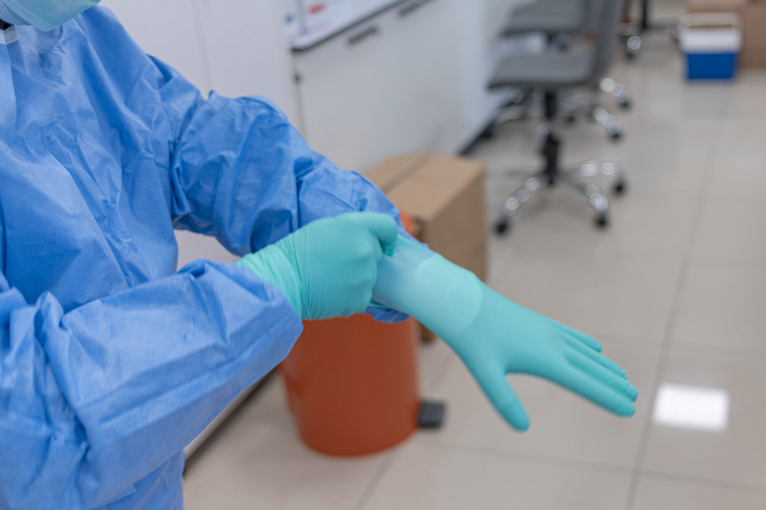 A molecular biologist as he wears protective glove at a laboratory of private hospital in Istanbul, on 1 May, 2020.