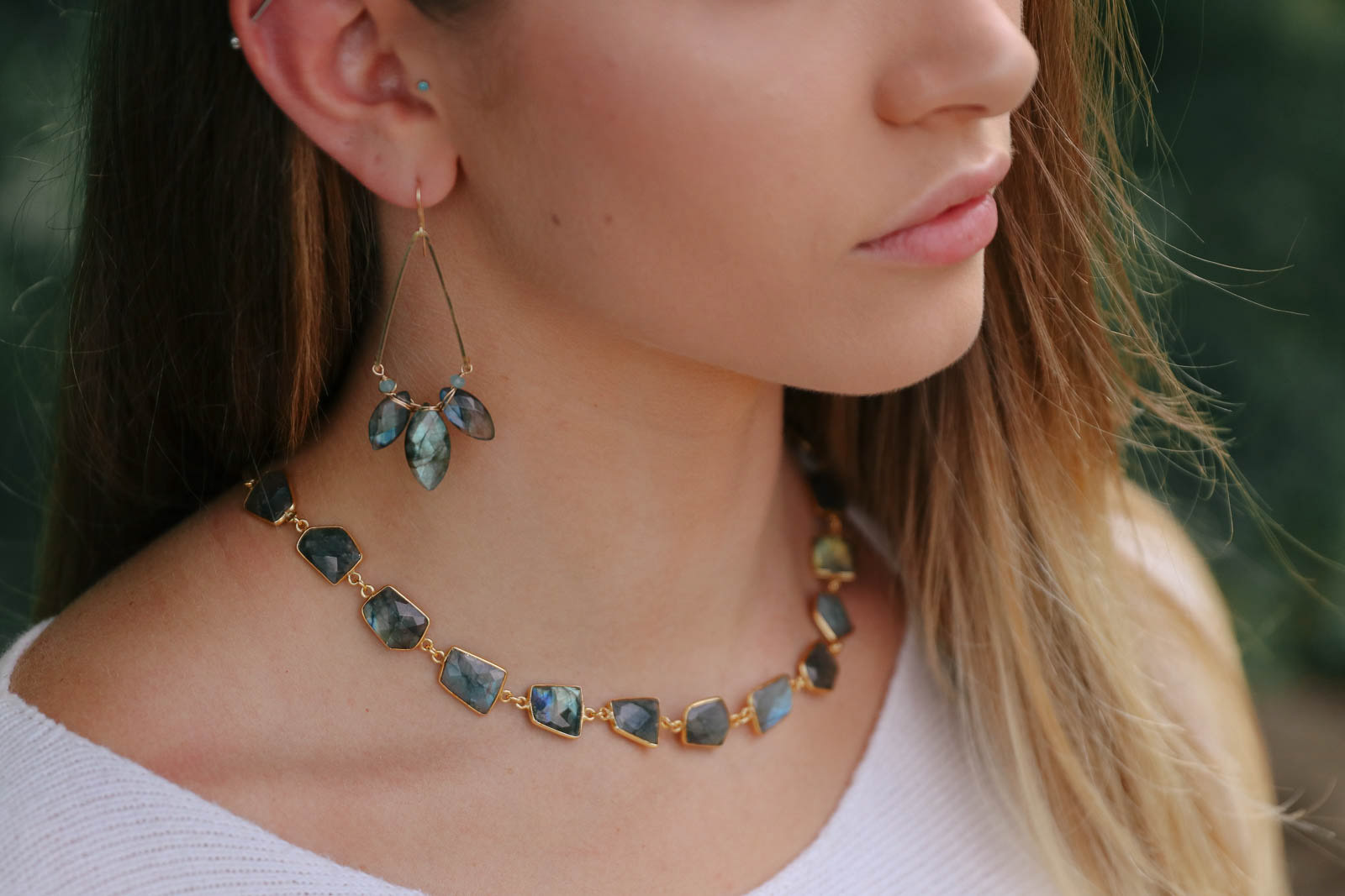 Young woman modeling Susan Goodwin Jewelry necklace and earrings