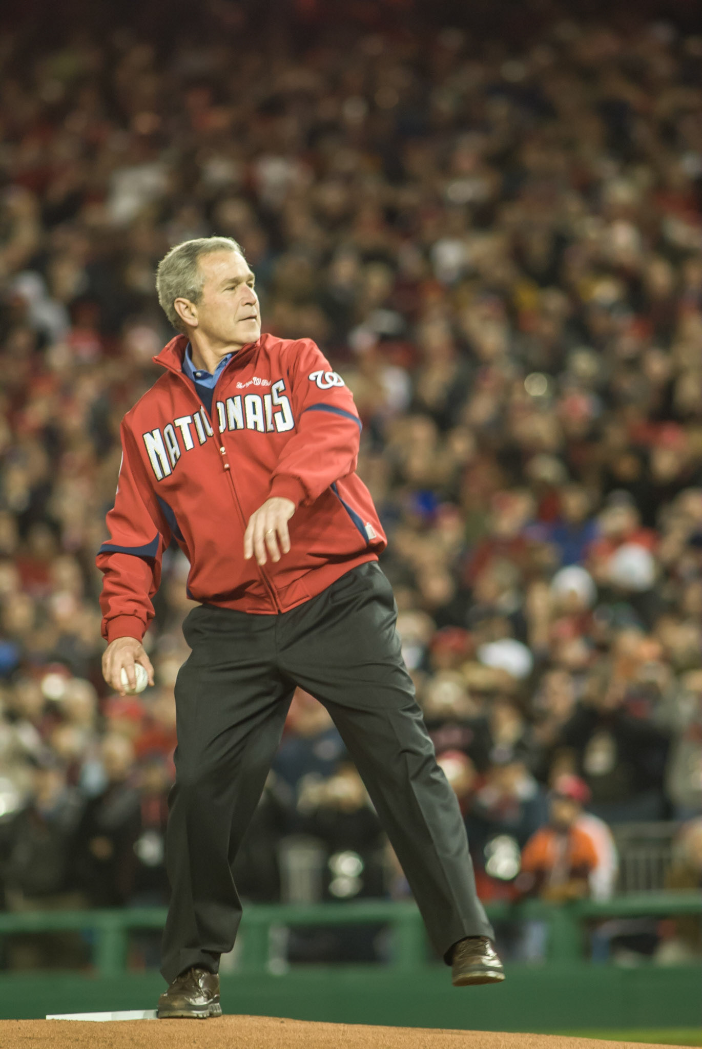 President George W. Bush throws out the ceremonial first pitch on Opening Day at the new Nationals Stadium, March 30, 2008.