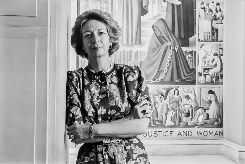 Anne Bingaman, Assnt. Attorney General for Antitrust, near a W.P.A. mural, "Contemporary Justice and Woman," at the Justice Dept, July 19, 1993