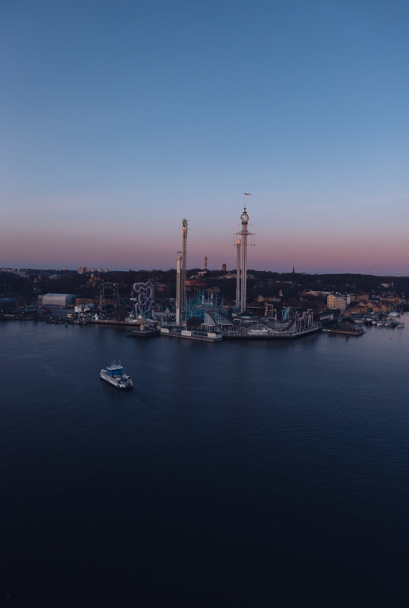 Gröna Lund amusement park in Stockholm, Sweden. Aerial drone view at sunset over Djurgården.