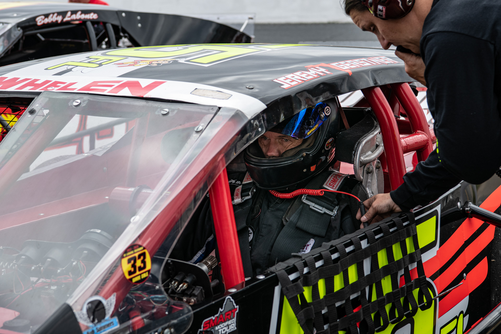 Jeremy Gerstner is strapped in by Dawn Gerstner before practice at Caraway Speedway in Sophia, N.C. on March 13, 2021.