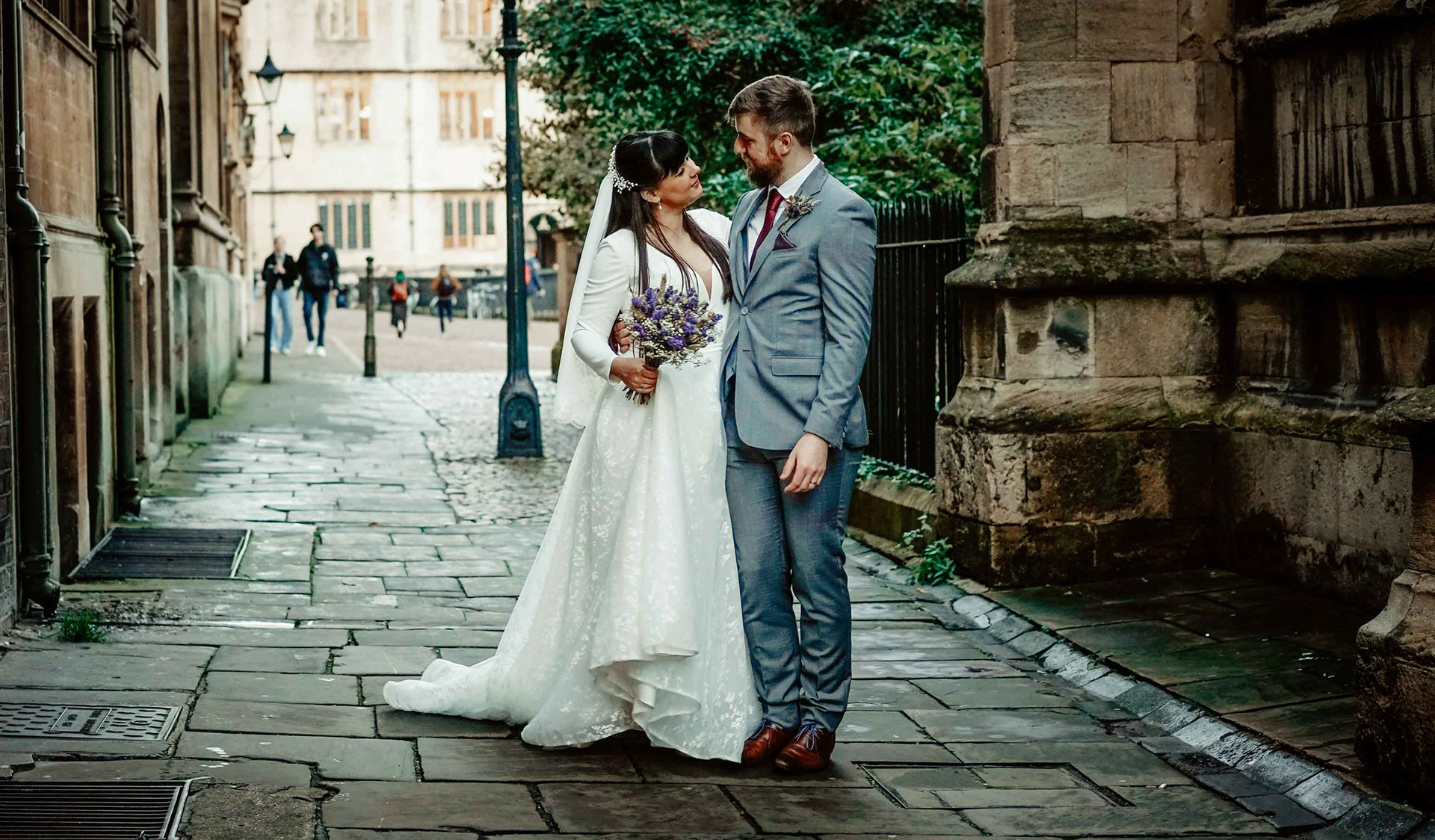 bride and groom stood in intimate romatic photo by david lefebvre in oxford street near radcliffe camera after covid wedding in december