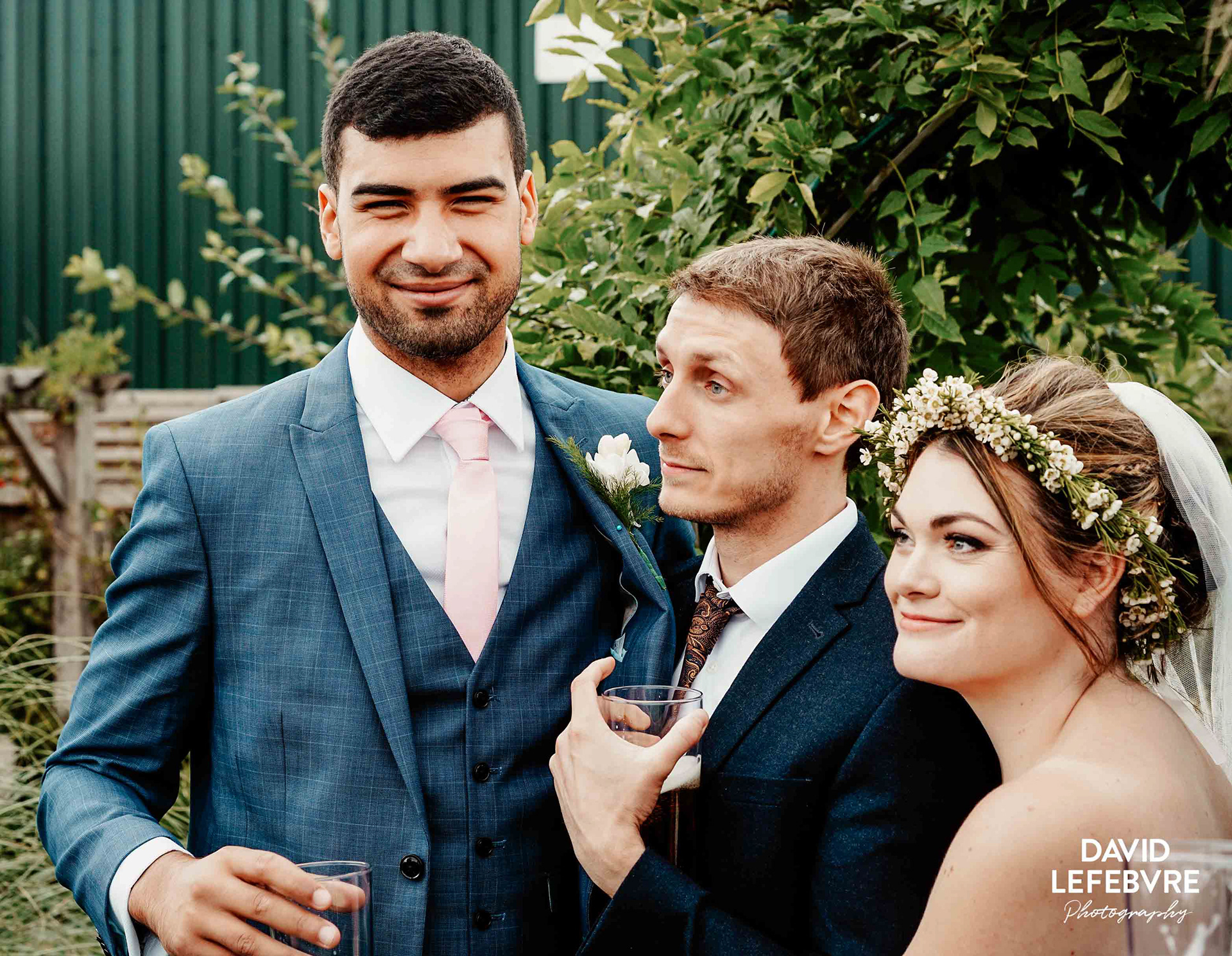 groom and bride with friend at owen house barn wedding