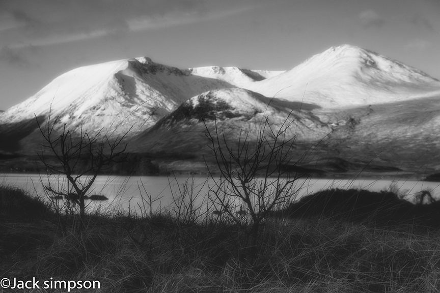 Atmospheric soft focus images of the Black Mount hills with Lochan na h-achlaise in the foreground.