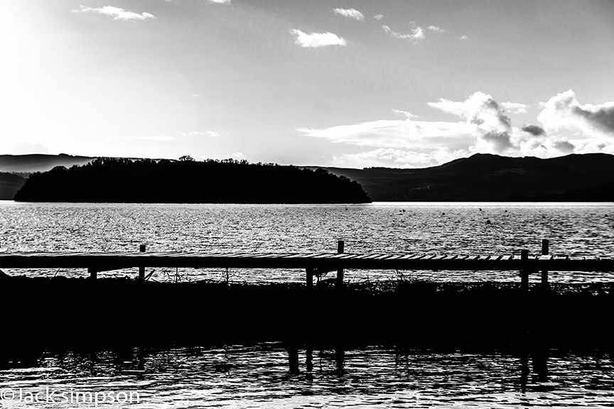Simple black & white image of the old pier at balmaha on the shores of Loch Lomond Scotland.