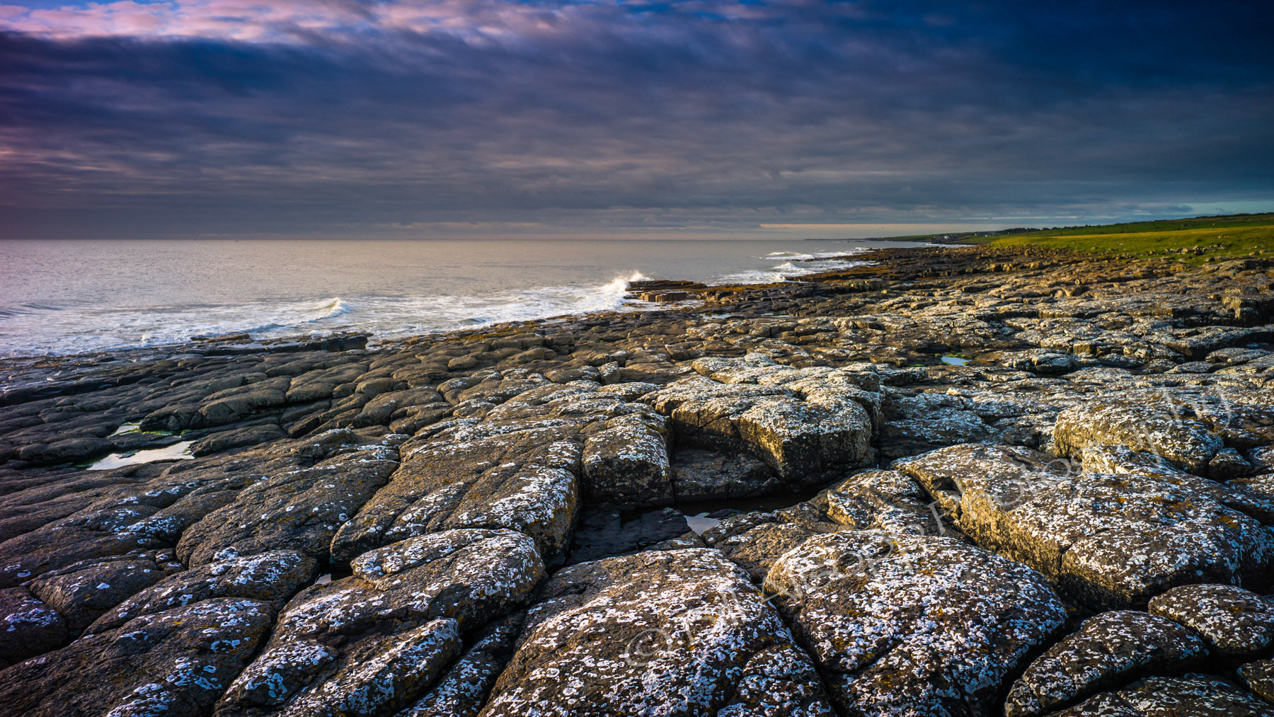 The rocky Northumberland coast just after dawn.