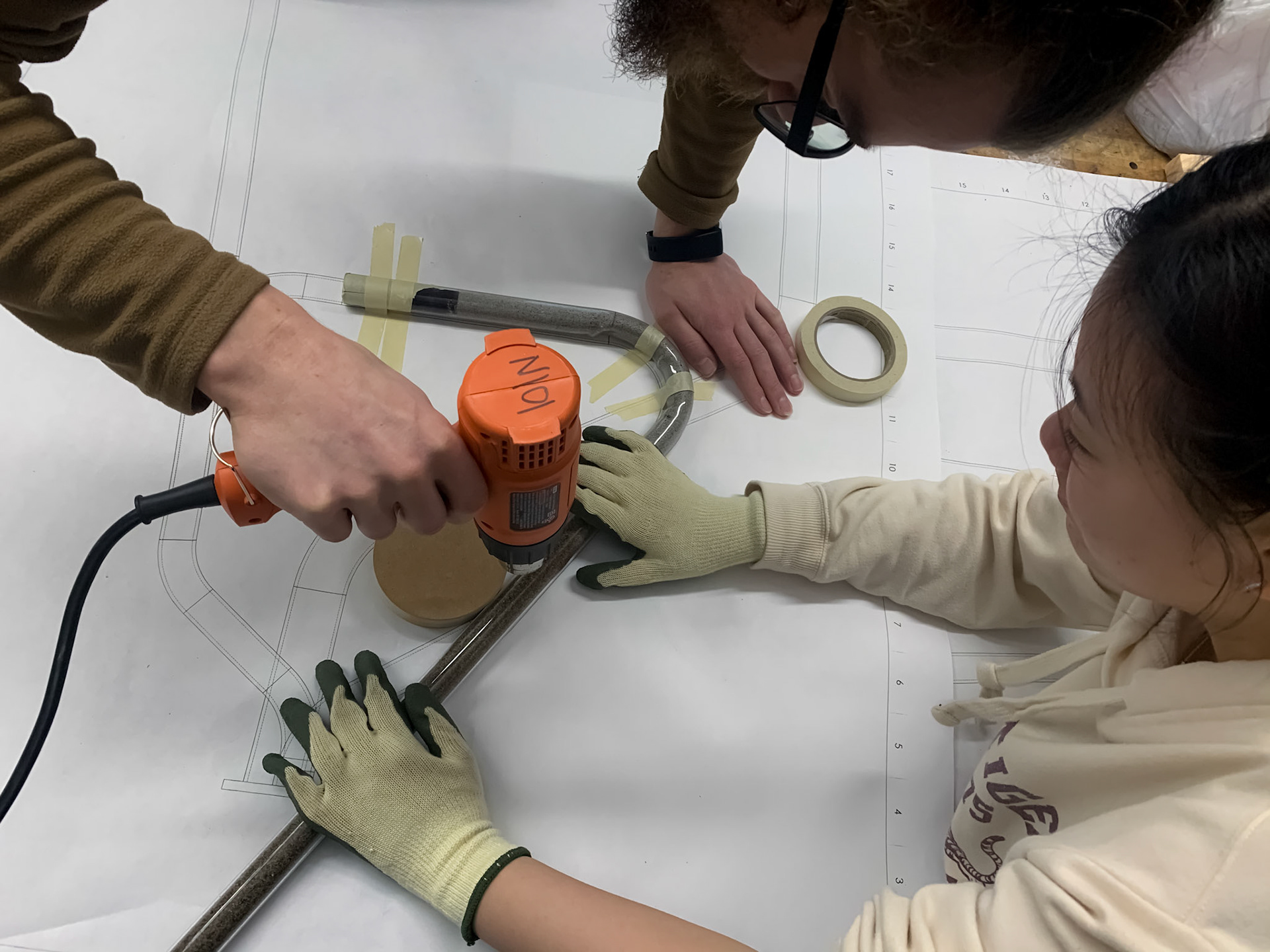 A heat gun allowed the sand filled acrylic tubing to be bent to fit the technical drawings.