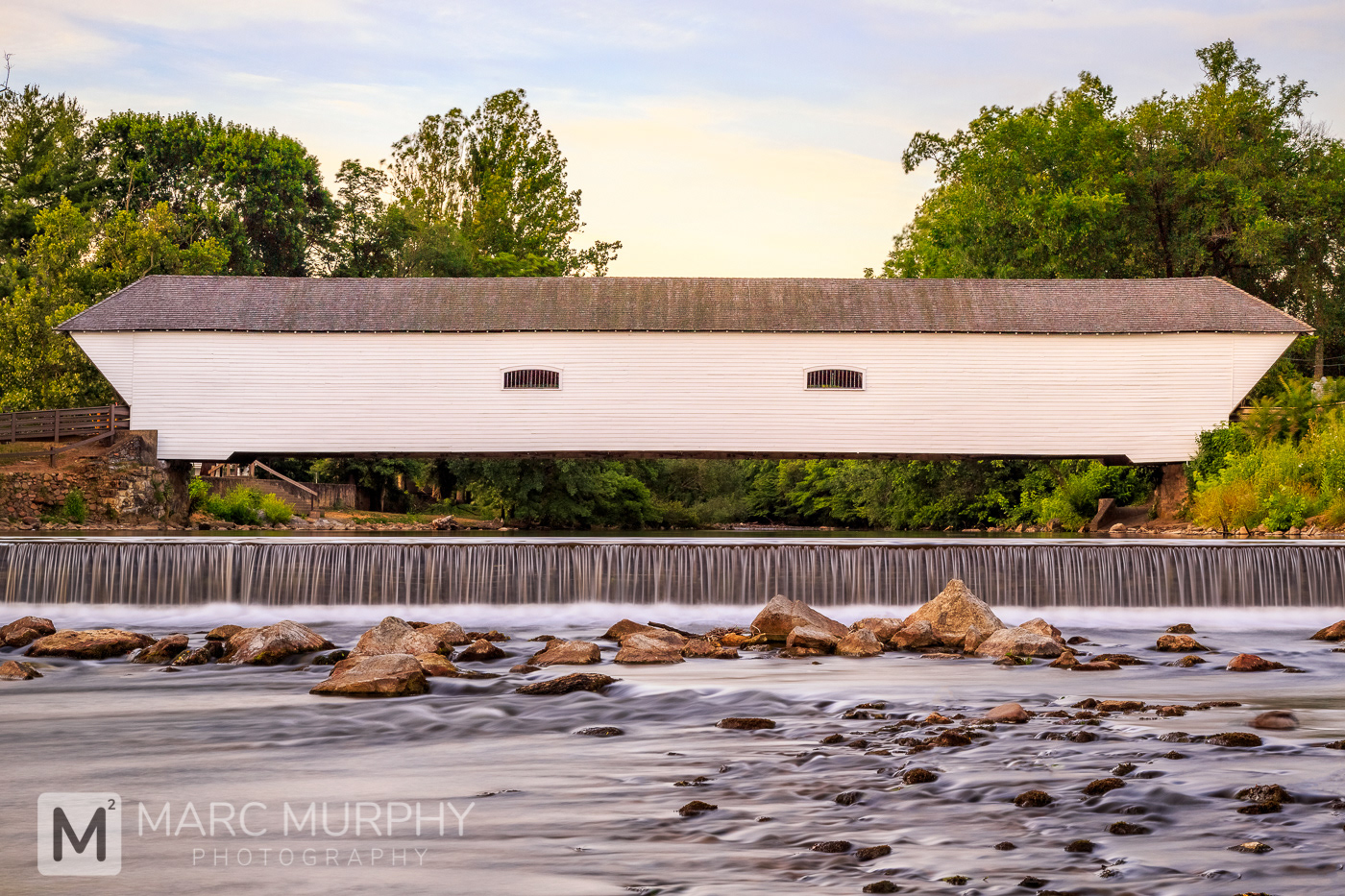 Elizabethton Tennessee Covered Bridge and Smooth Doe River with Waterfall and Rocks