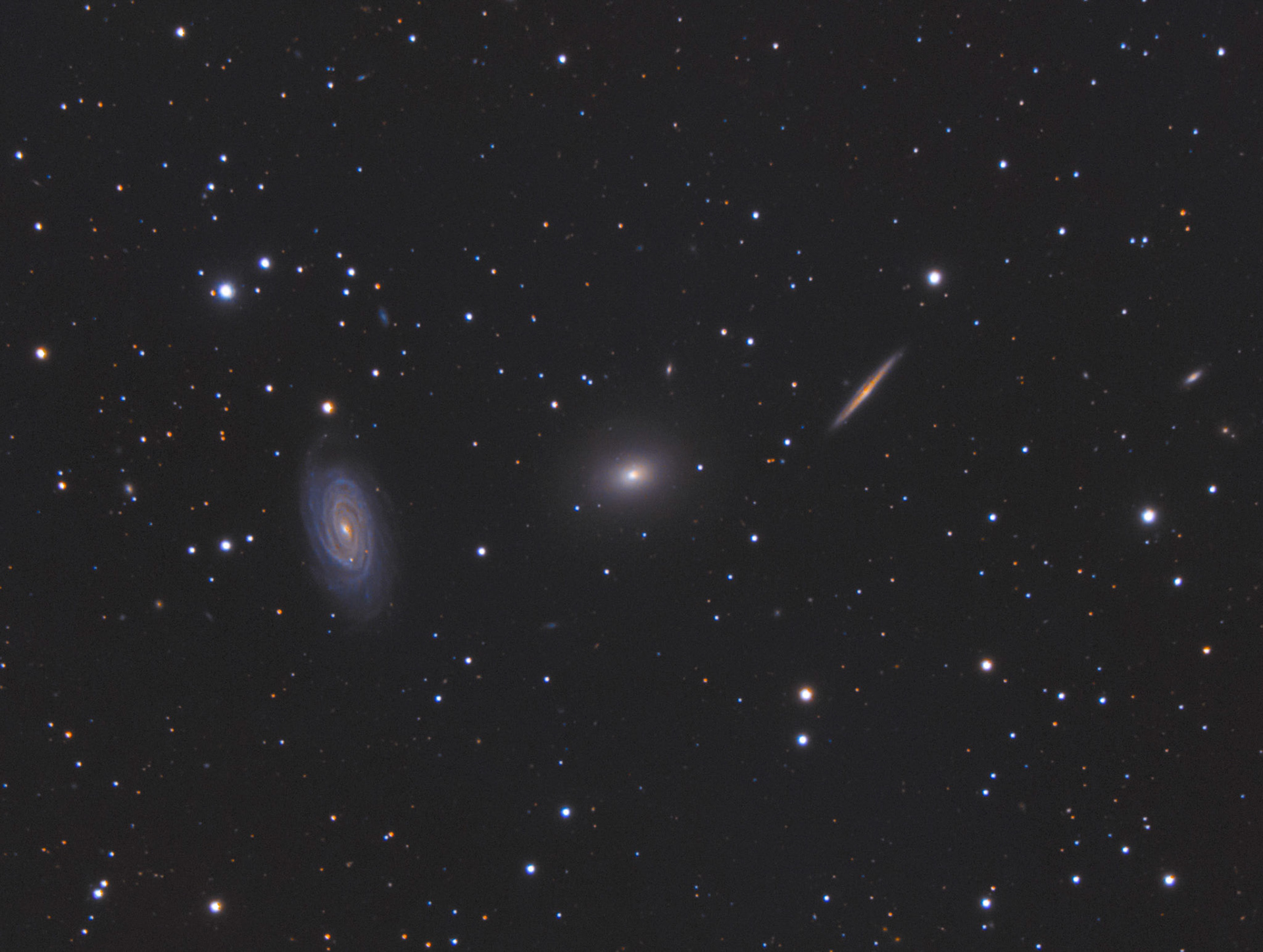 The Draco TripletA nice grouping of three galaxies in the constellation Draco. Although it looks like they are close together, they only appear that way because they are roughly lined up along our line of sight.
