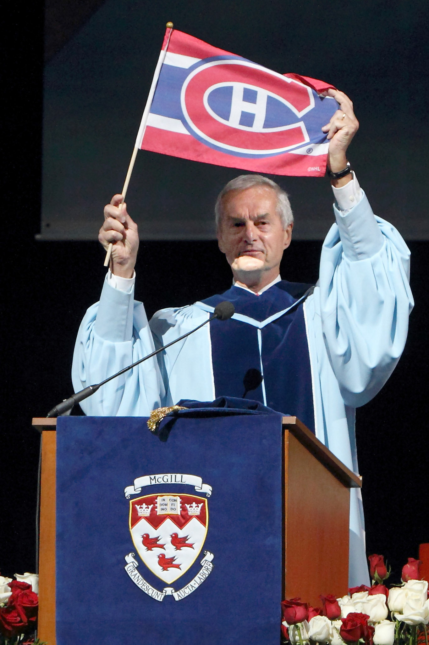  Professor David Harpp warms up the crowd at the Bell Centre before a Convocation ceremony, June 2012. The proceedings were moved from their traditional outdoor location due to the possibility of disruption by protests. 