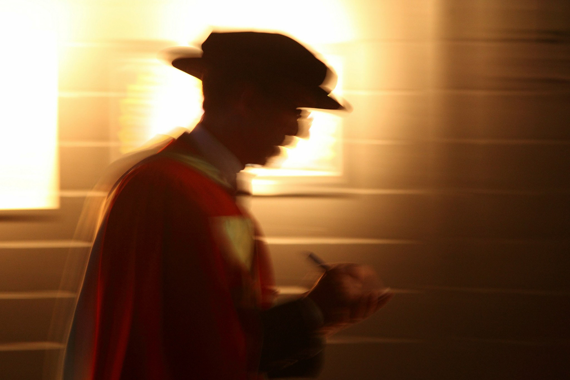  In a corridor backstage at the Bell Centre, Morton Mendelson makes some last-minute notes as he hurries towards the Convocation stage. June 2012.