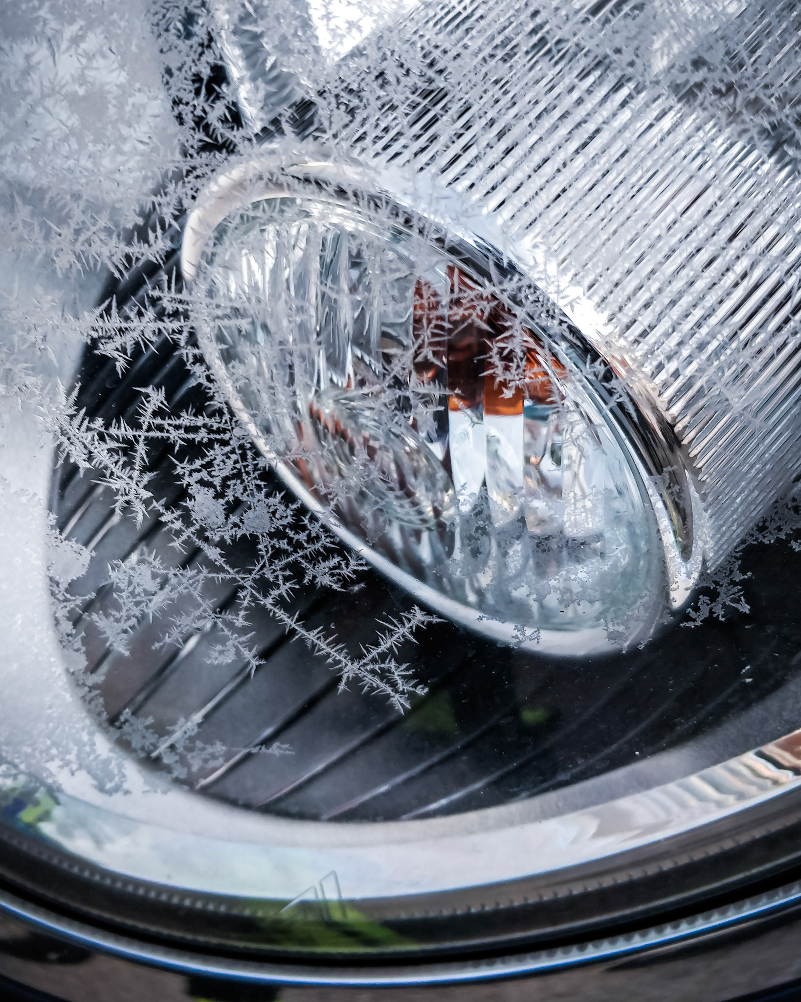 Ice covering the Mini headlight.