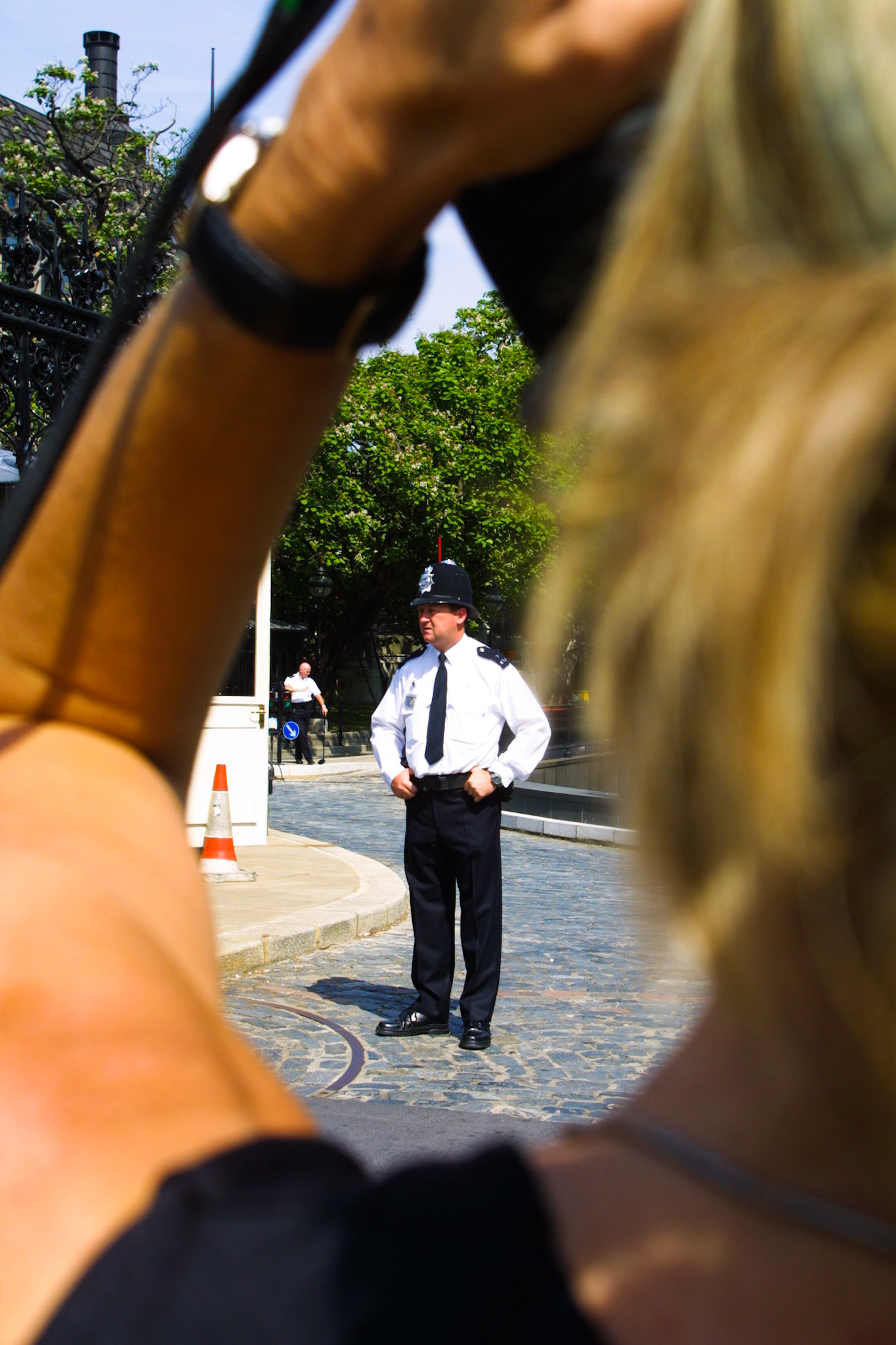policeman being photographed