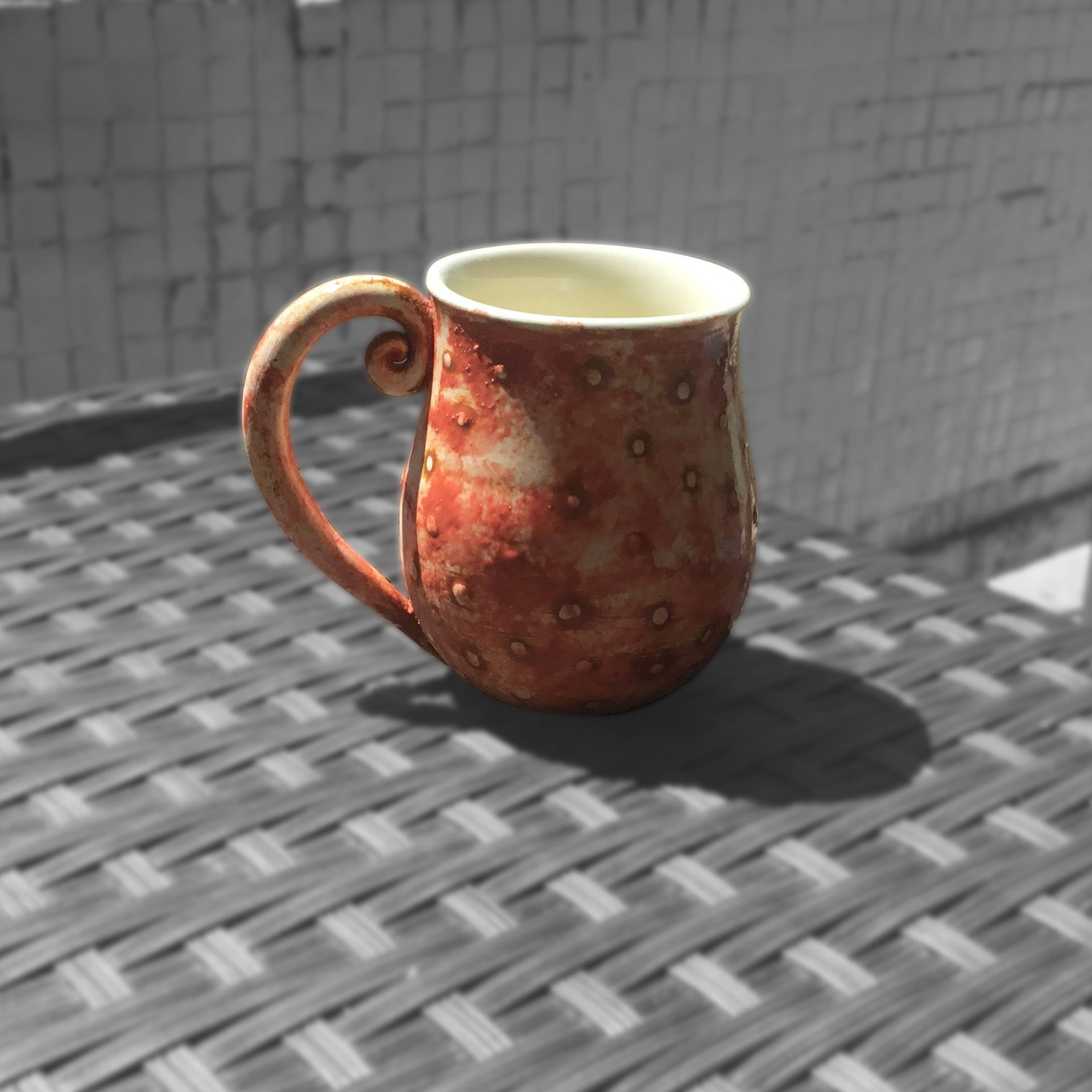 a thrown cup, earthenware
