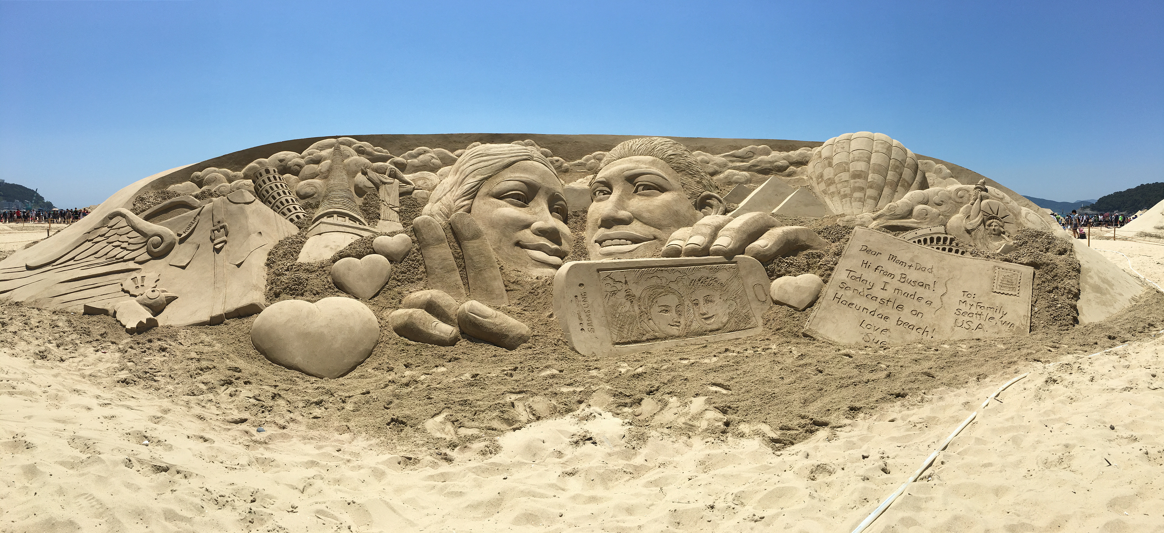 Artists Sculpting Giant Pile of Sand Into Largest Sandcastle