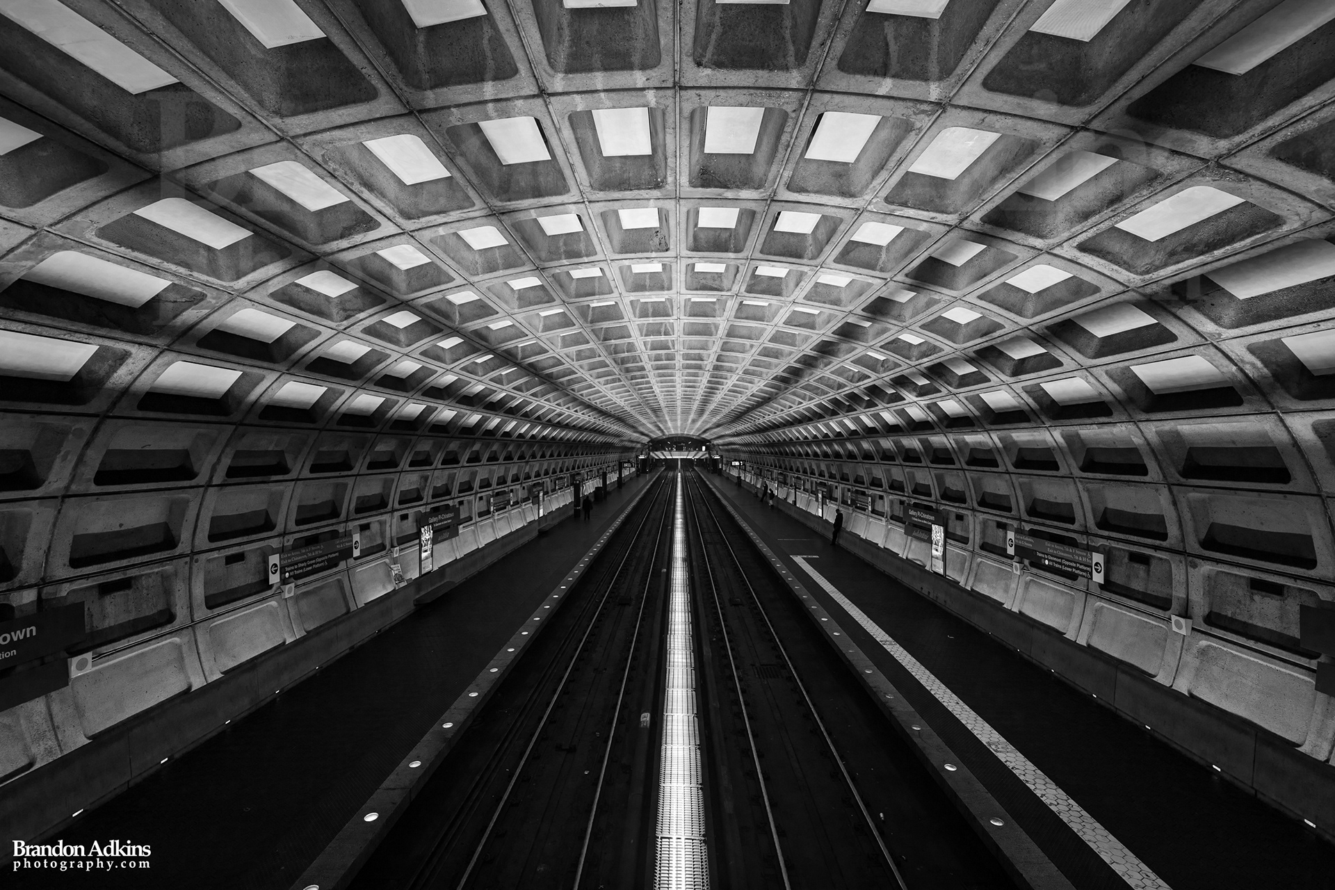 Fine art photograph of metro underground subway station with waffle vaulted ceiling and brutalist design in Washington, DC