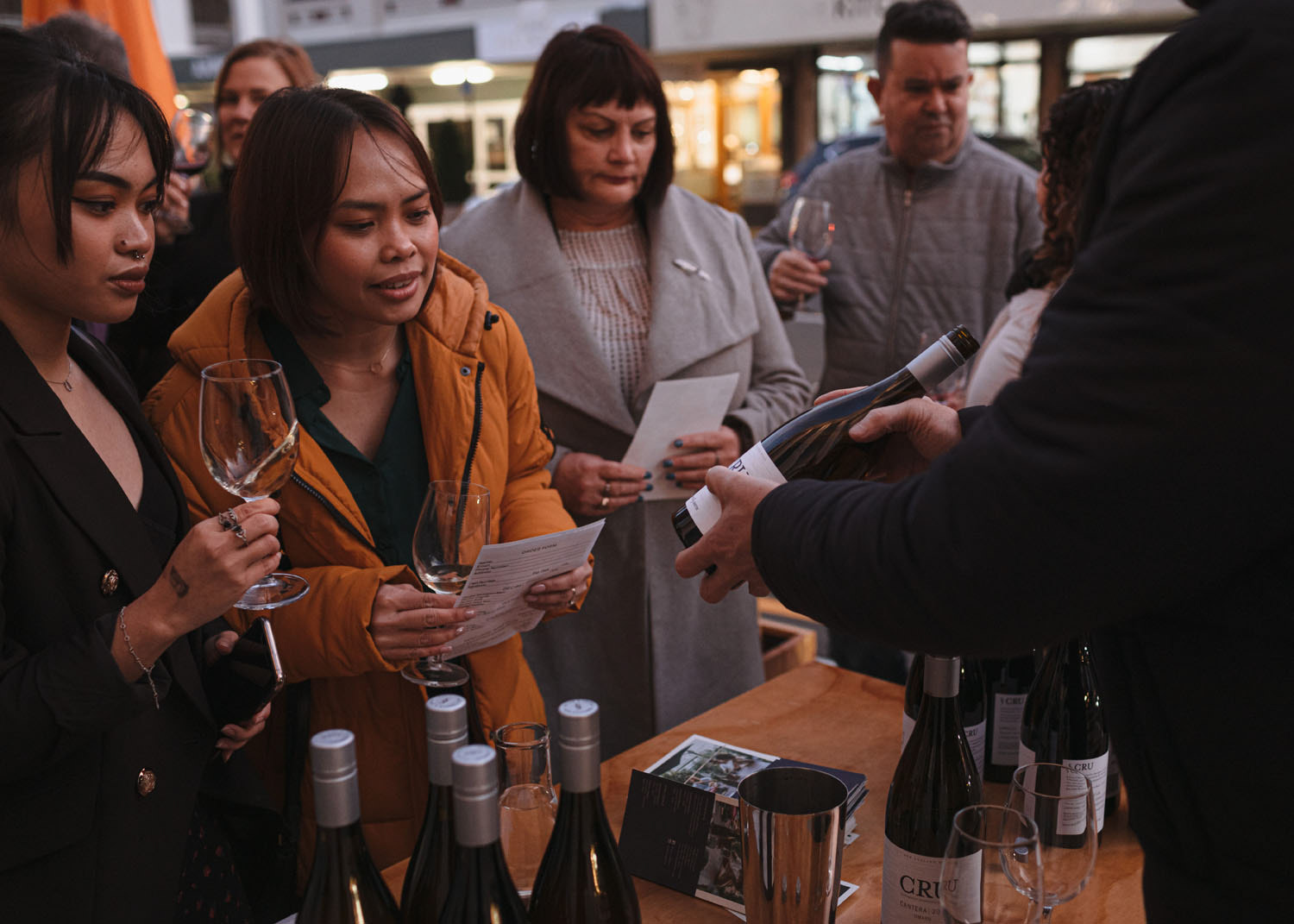 Guests being shown the wine tasting offers