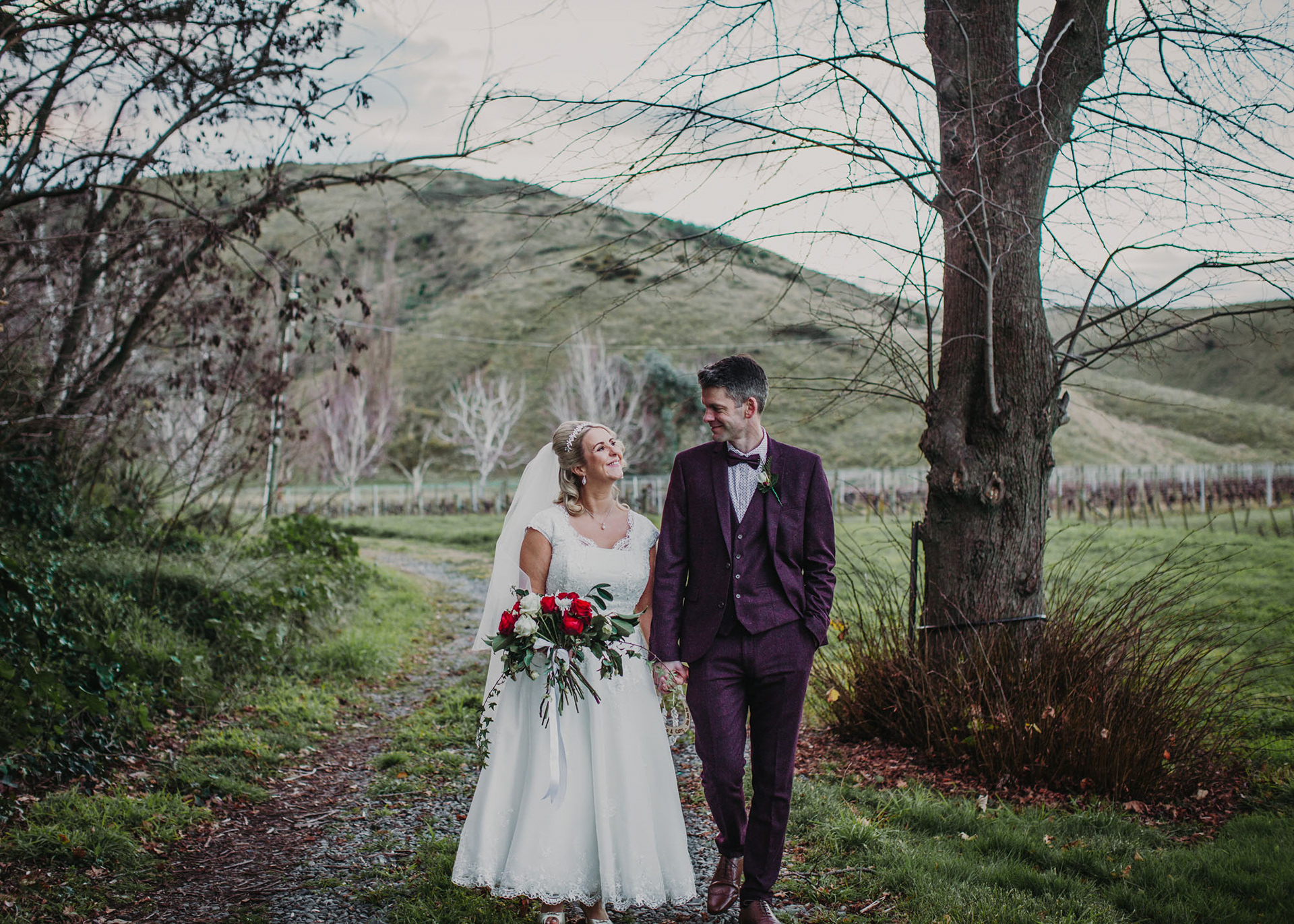 Nicola and Gary wandering the grounds of Mission Estate Winery after getting married in the winter