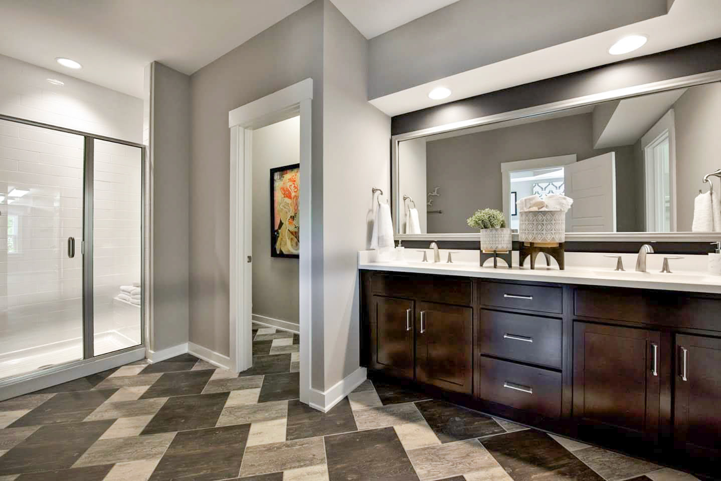 Personal Selections: Tile & lighting. Other selections made by Model Home Interiors. Photo Credit: Stanley Martin Homes.
